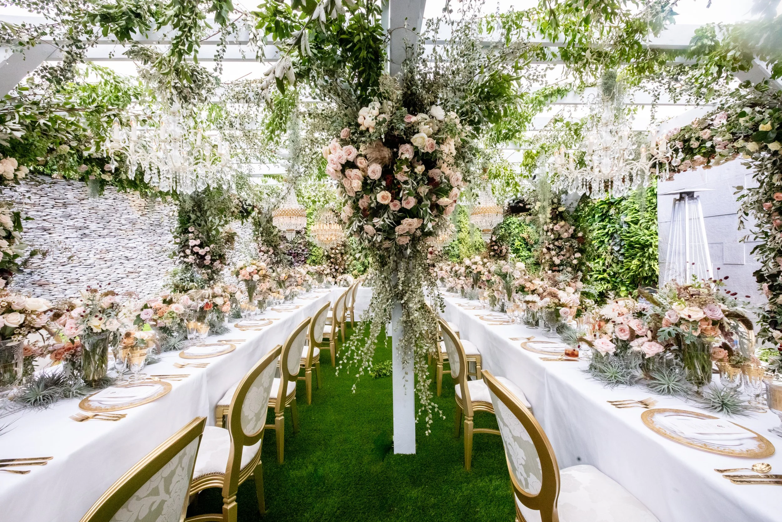 Custom built pergola with chandeliers and exquisite florals: the setting for the UK's first luxury hybrid micro-wedding breakfast during the 2020 pandemic. 