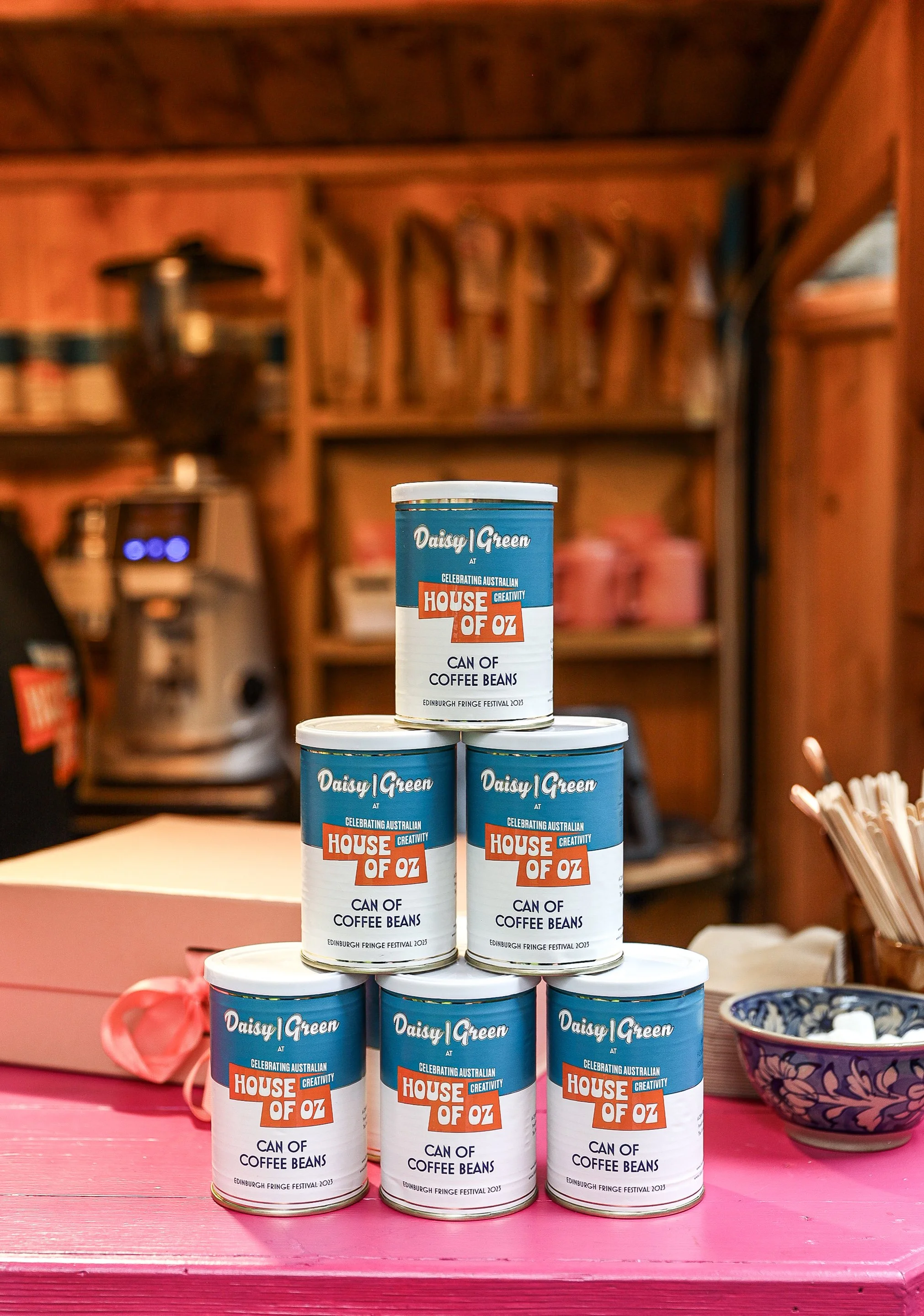 Coffee experts Daisy Green created these limited edition, House of Oz branded  "cans of beans" for Edinburgh 2023. Photographed on site at our pretty pop-up. 