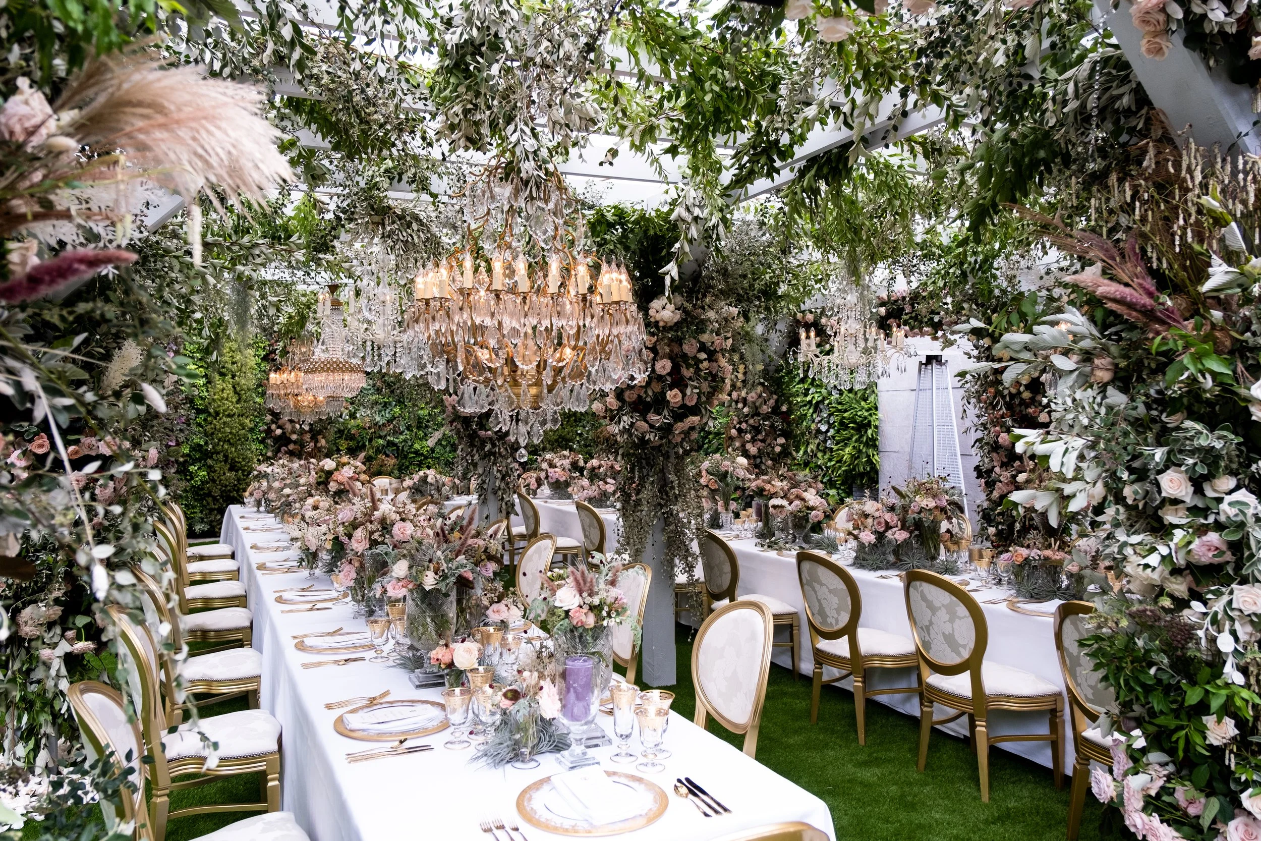 Custom built pergola with chandeliers and exquisite florals: the setting for the UK's first luxury hybrid micro-wedding breakfast during the 2020 pandemic. 