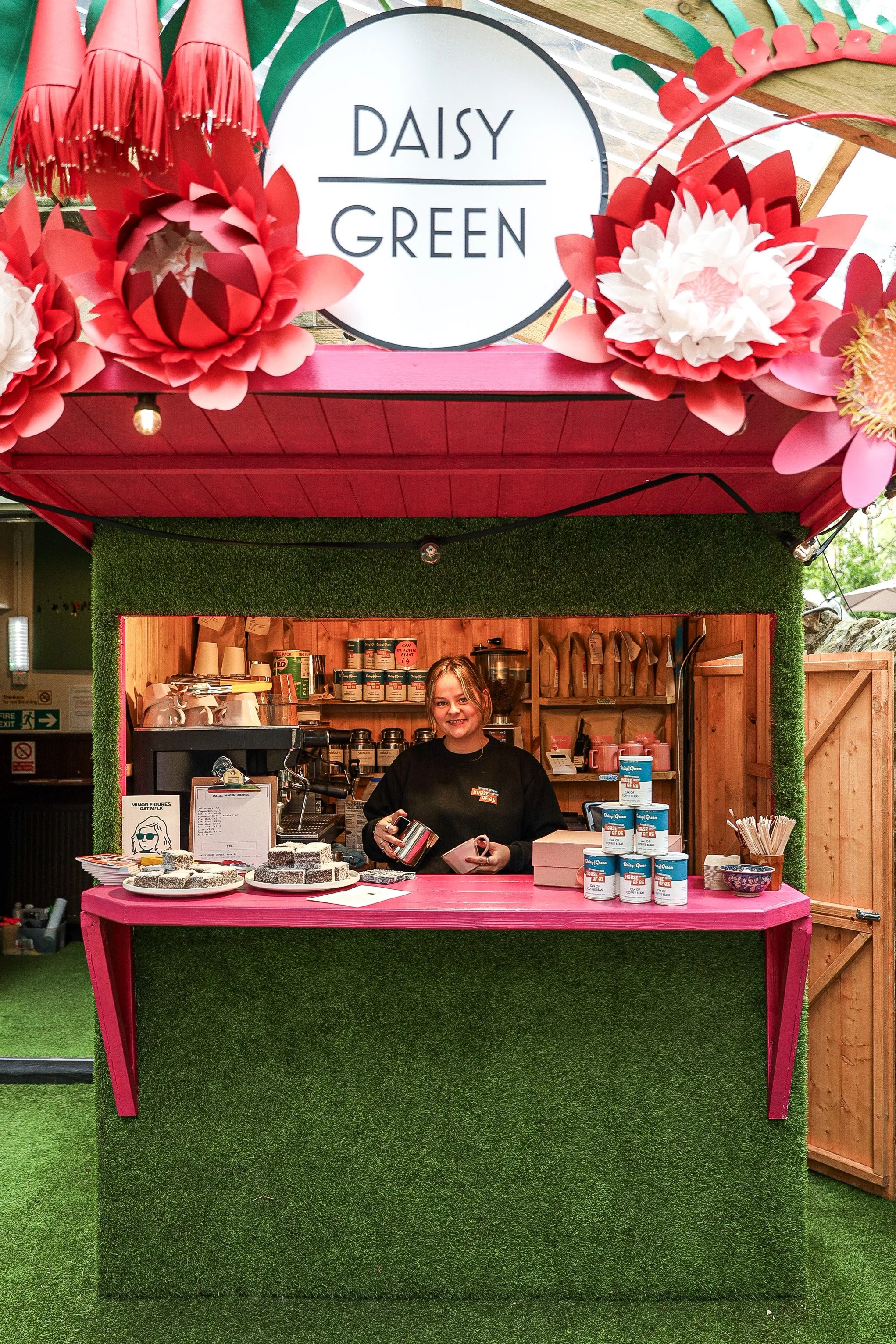 Blu Fire established an F&B partnership with Daisy Green for House of Oz in Edinburgh. This is our 2023 coffee & lamingstons stand in the astroturfed side terrace, decorated with giant paper flowers.