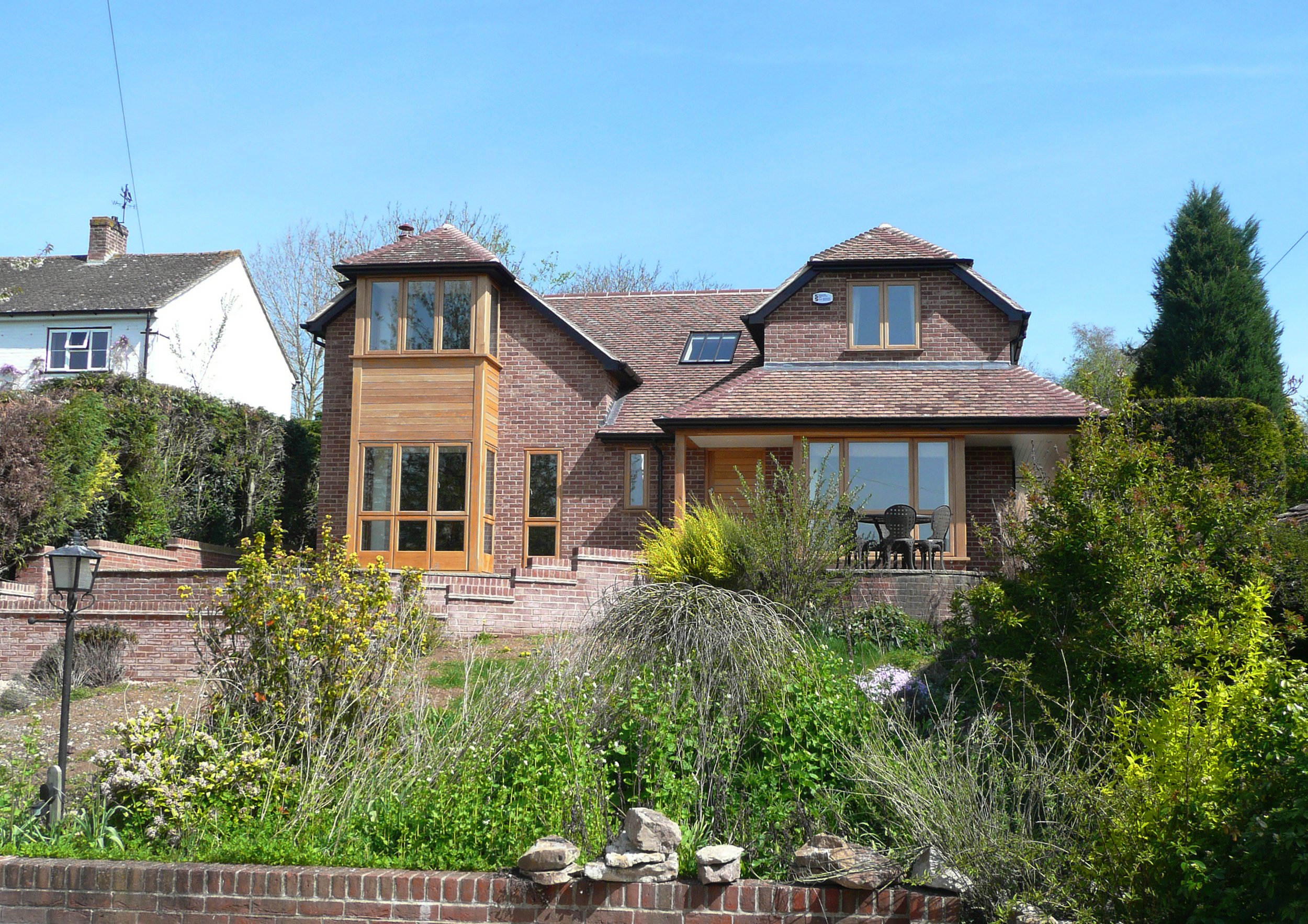 Primary entrance elevation of extension of remodelled development to two-storey property