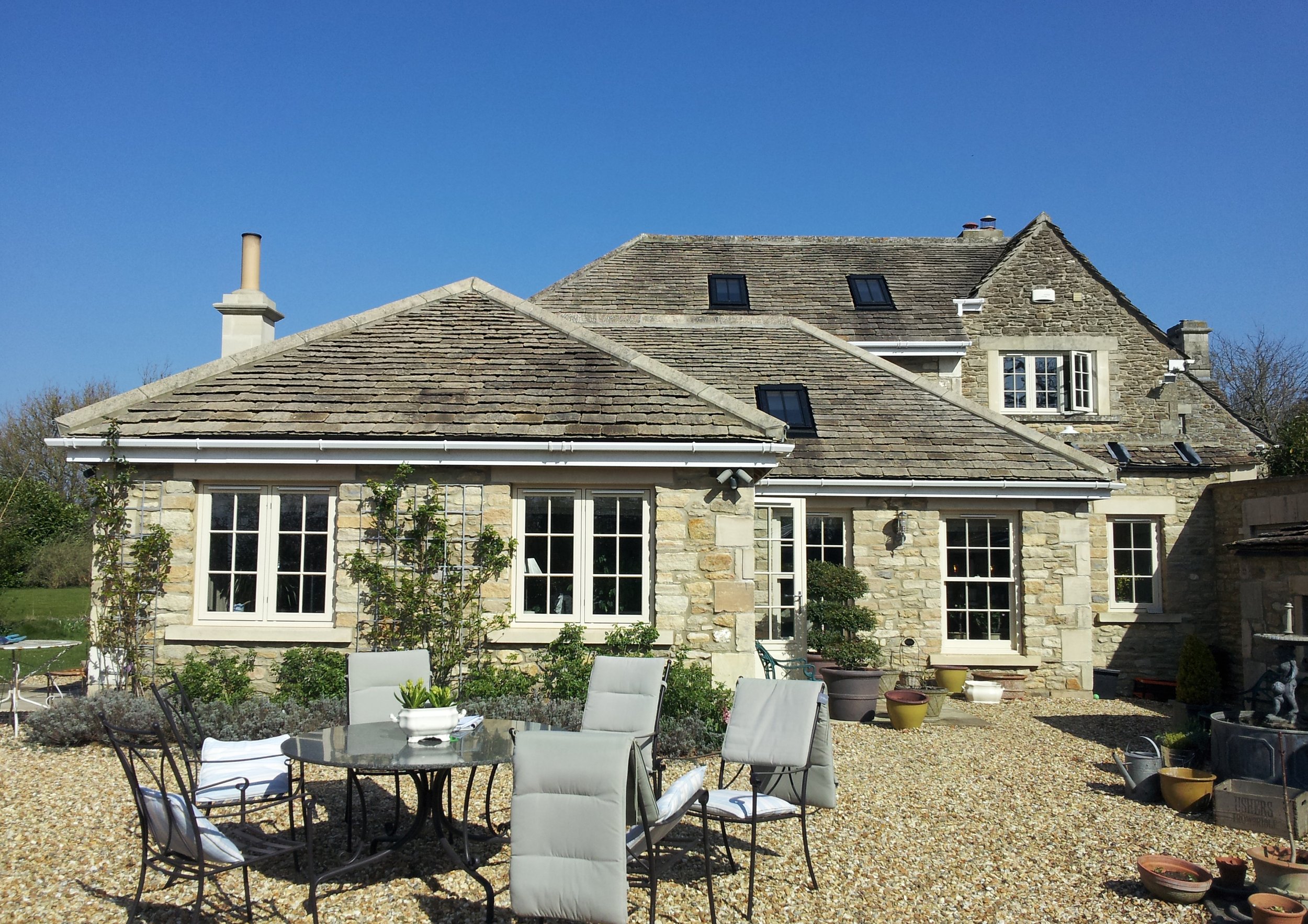 Single and two storey extension and alteration to property in heritage protected setting. Formed using natural stone slates and facing materials which match the existing building.