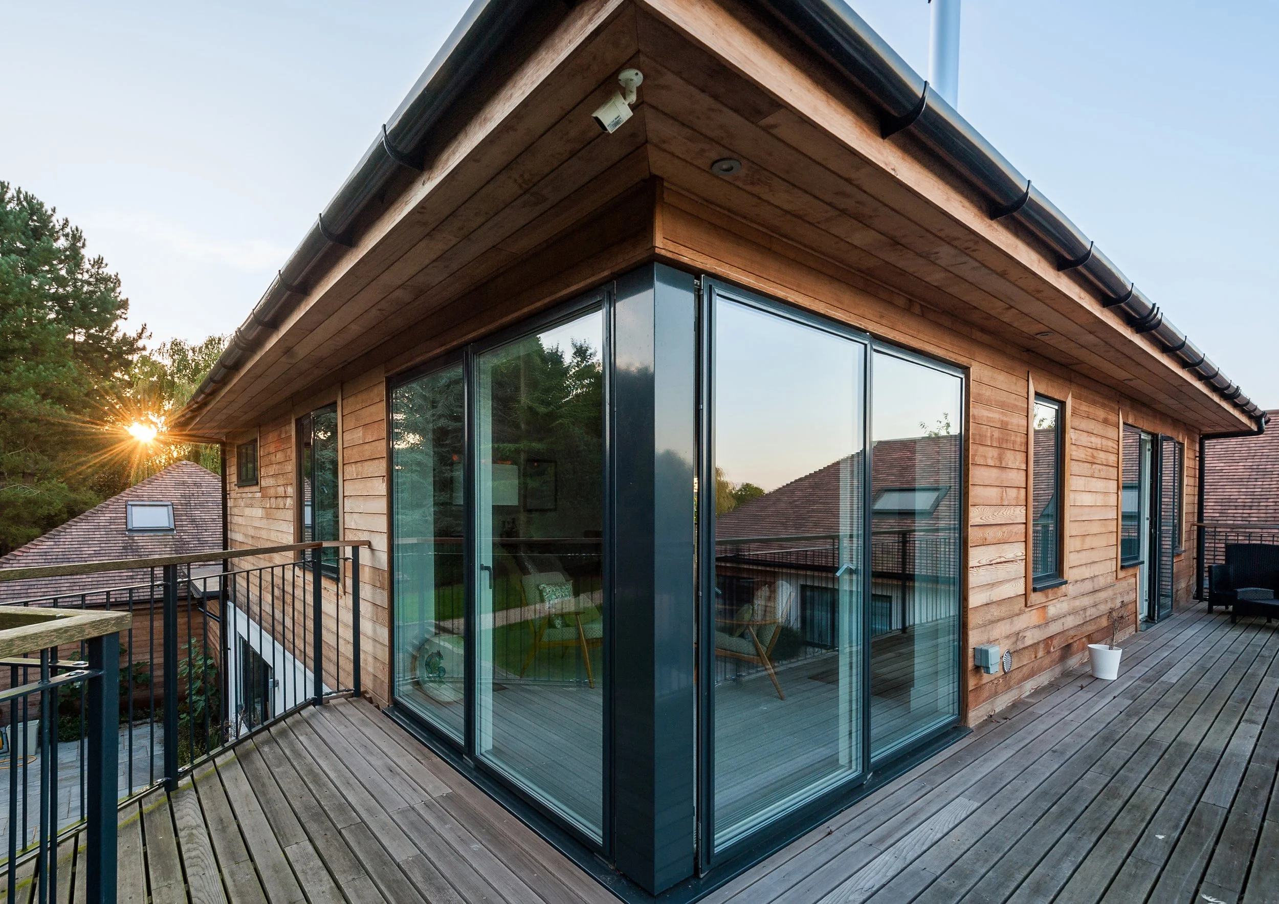 Wide Angle Photography of corner window joint on upper floor of new open plan replacement dwelling, taken from the adjacent balcony.