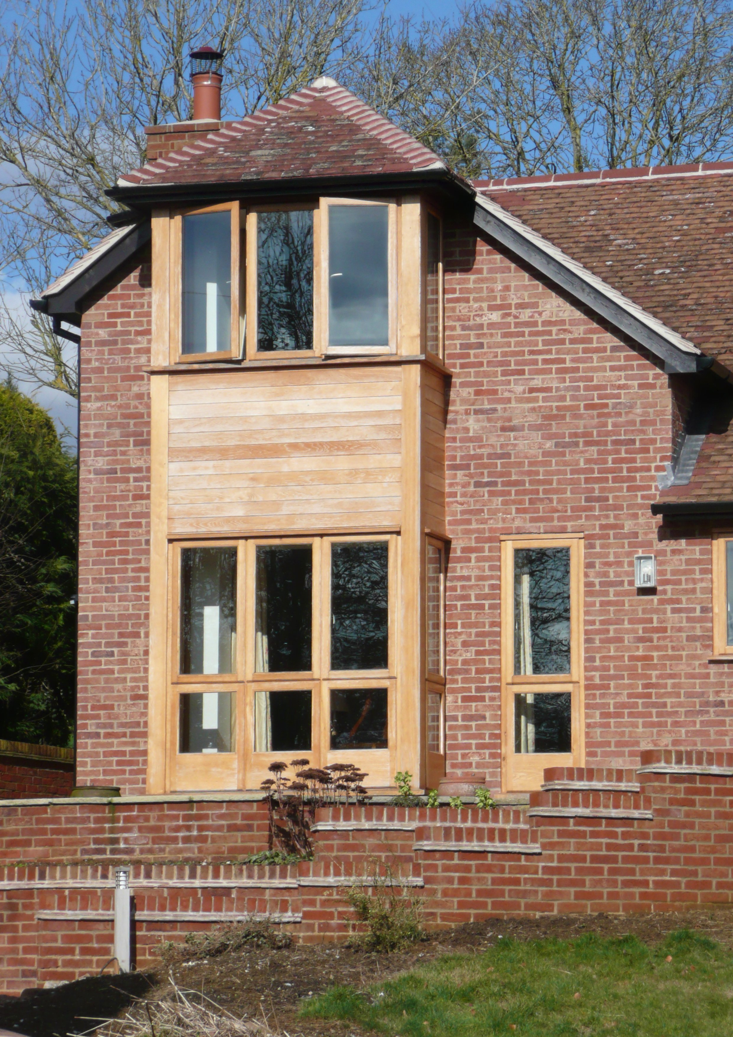 Primary entrance elevation of extension of remodelled development to two-storey property as seen from the street view