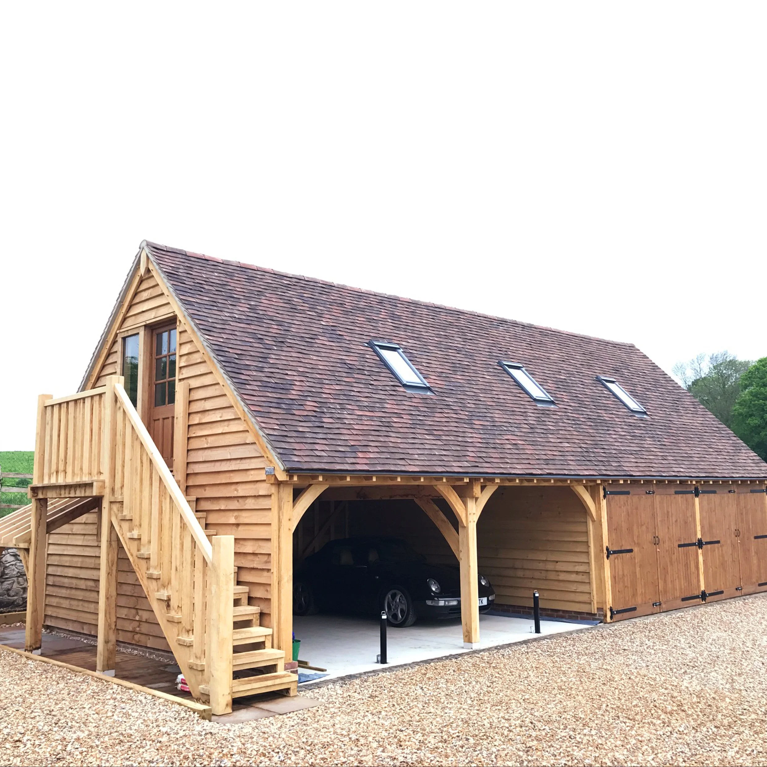 Exterior façade of new oak framed carport and Annexe on the property of 17th century house.