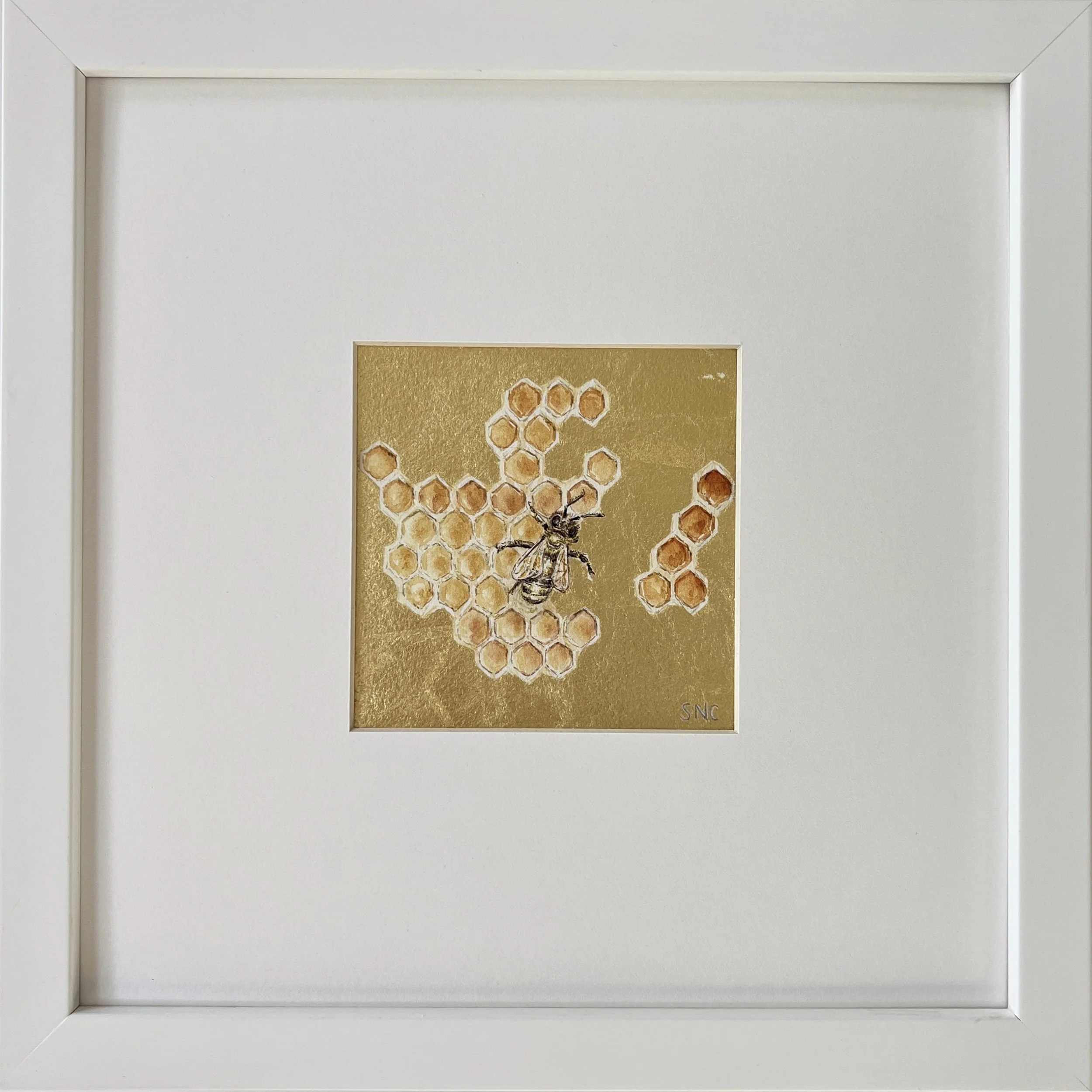 Honey Bee Gem. Watercolor and 22 karat gold. Matted and framed in a white gallery frame. 10x10 inches.