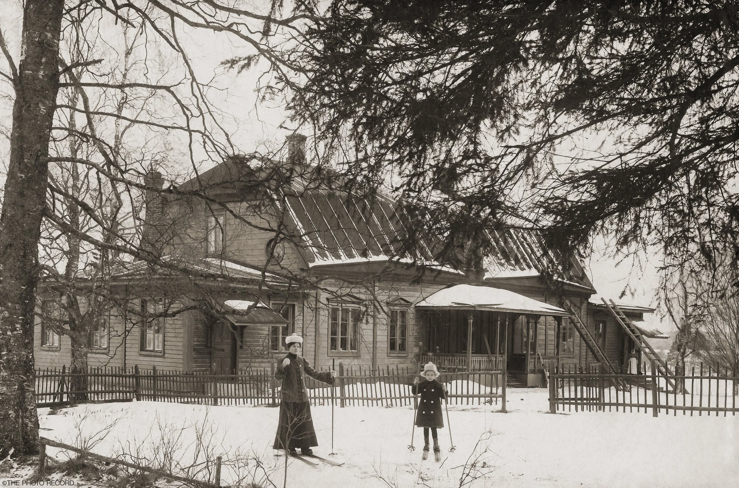 Woman and Child on Skis in Iisalmi