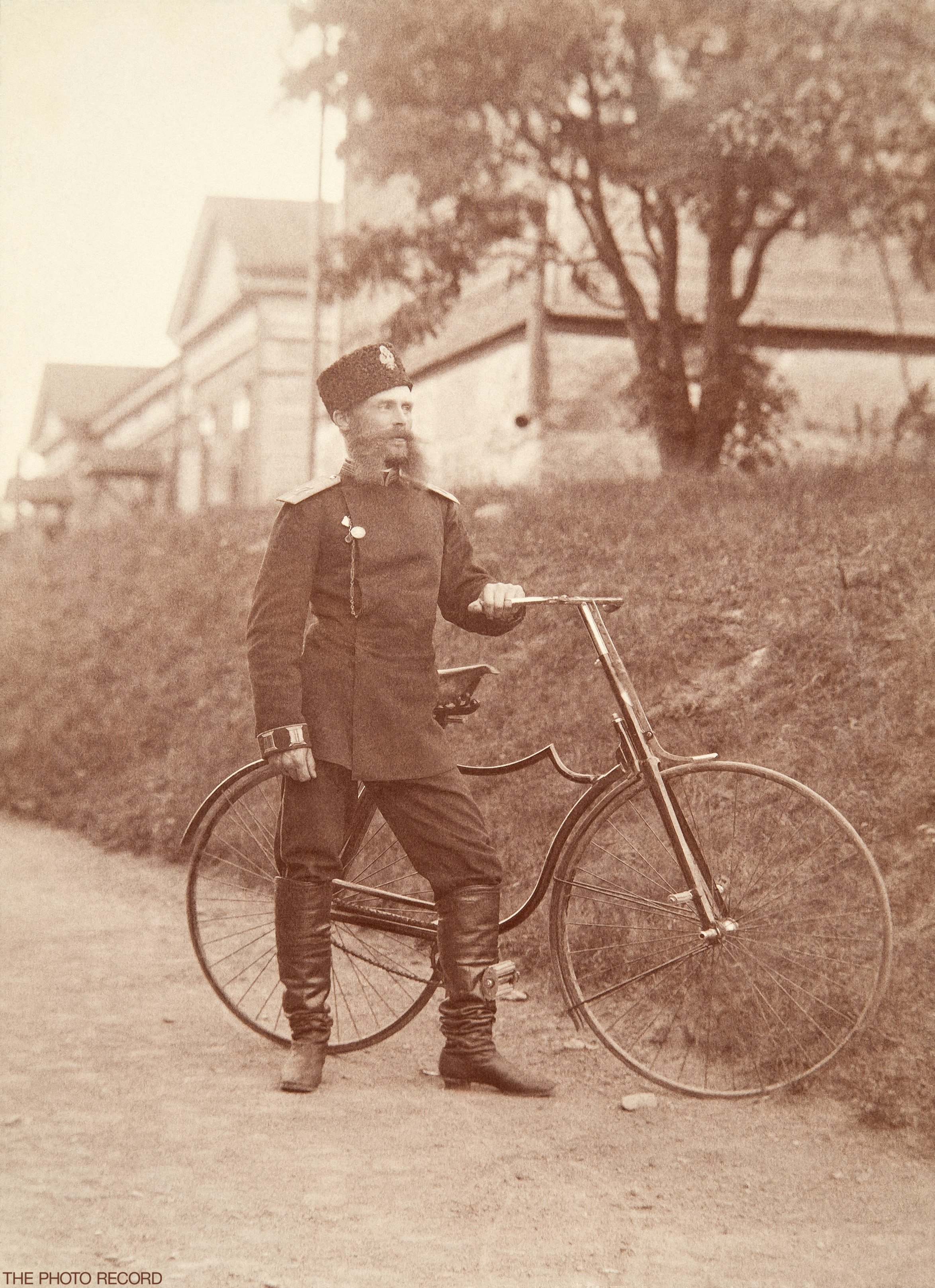 A Man in Uniform and a Bicycle