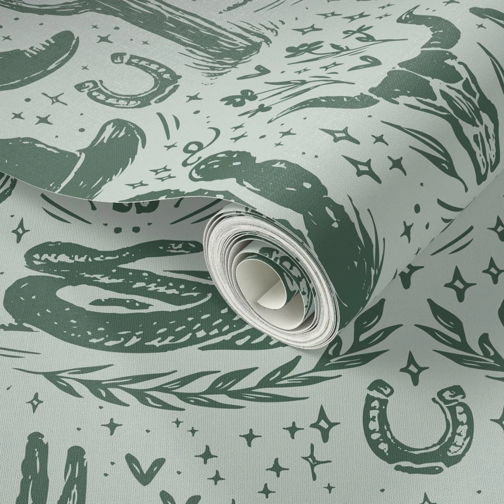 Texas themed wallpaper design with boots, cactus plants, snakes, & cow skulls