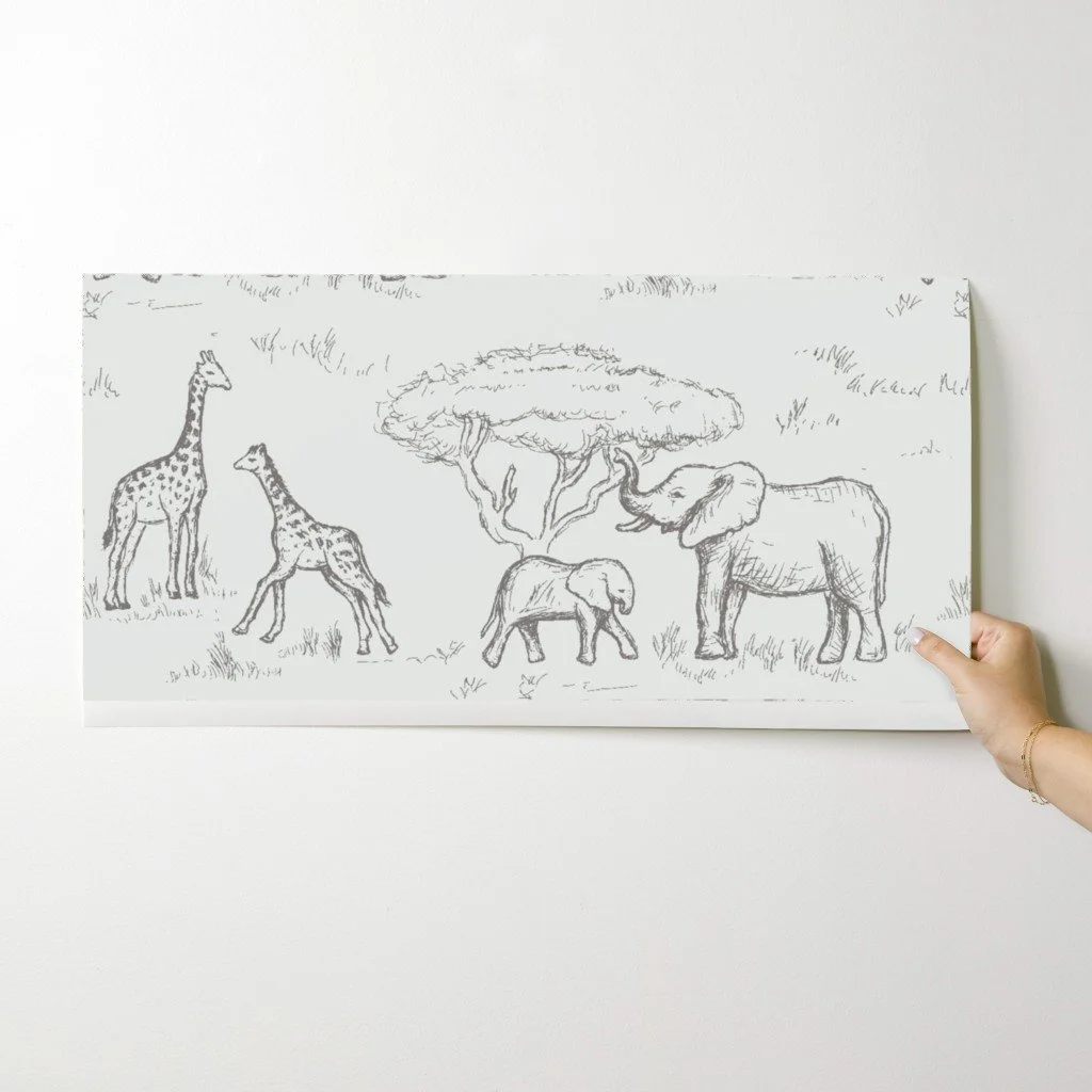 artisan-hand-placing-a-sample-of-the-serengeti-sketch-wallcovering.jpg