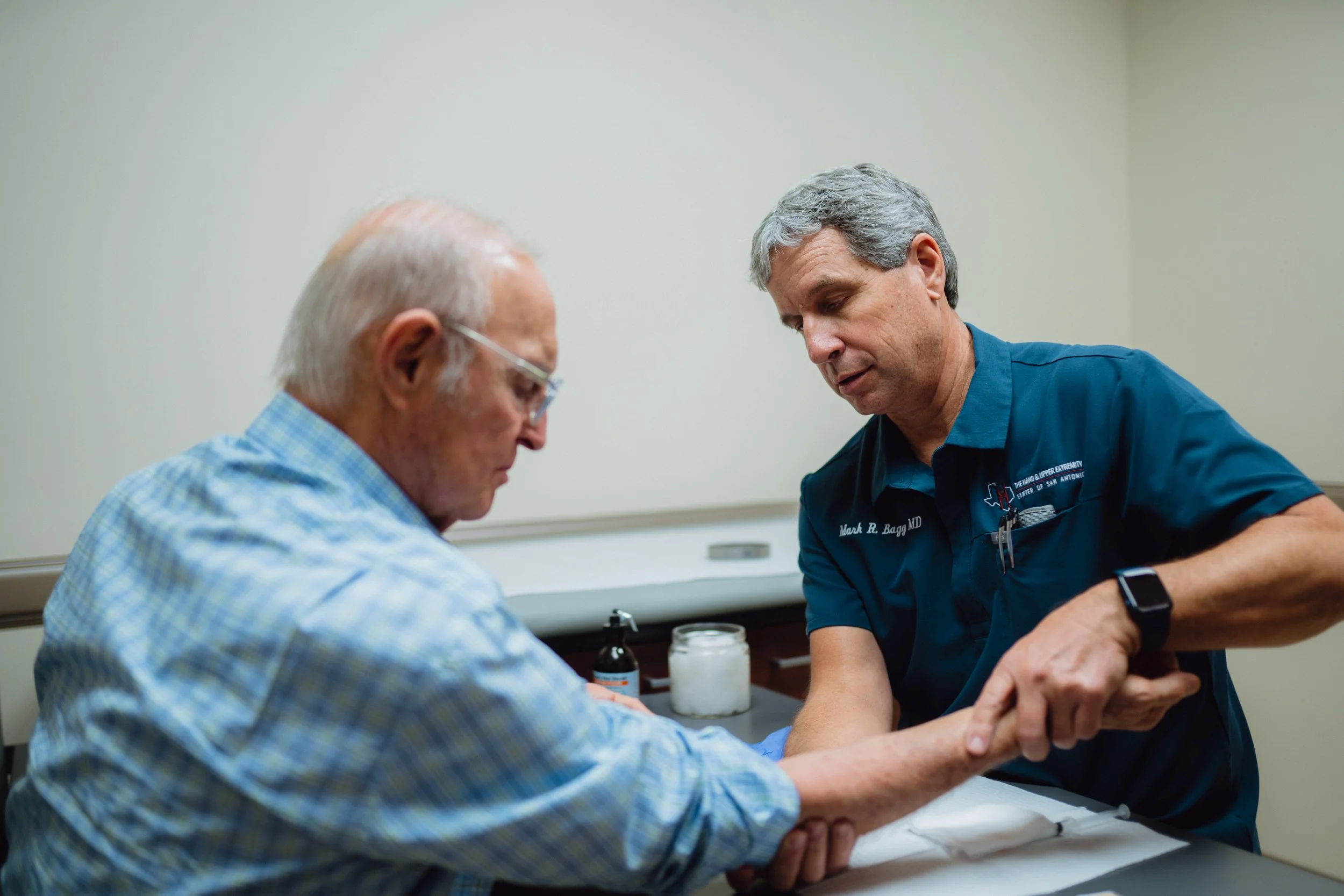 Elbow specialist evaluating a UCL injury at Hand & Upper Extremity Center of San Antonio in San Antonio, Texas