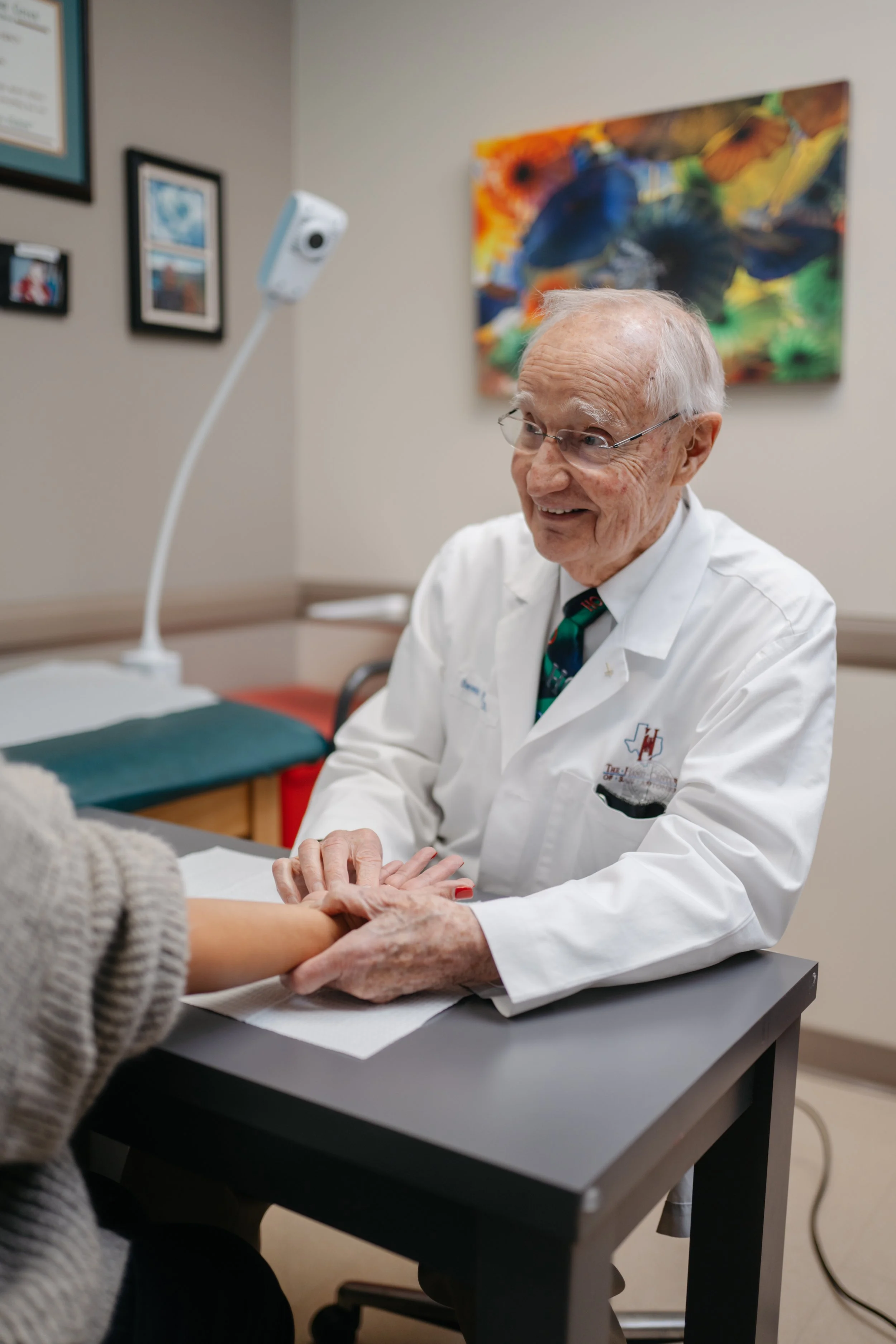 Certified Hand Therapist assisting patient with wrist pain recovery exercises at The Hand & Upper Extremity Center of San Antonio, texas