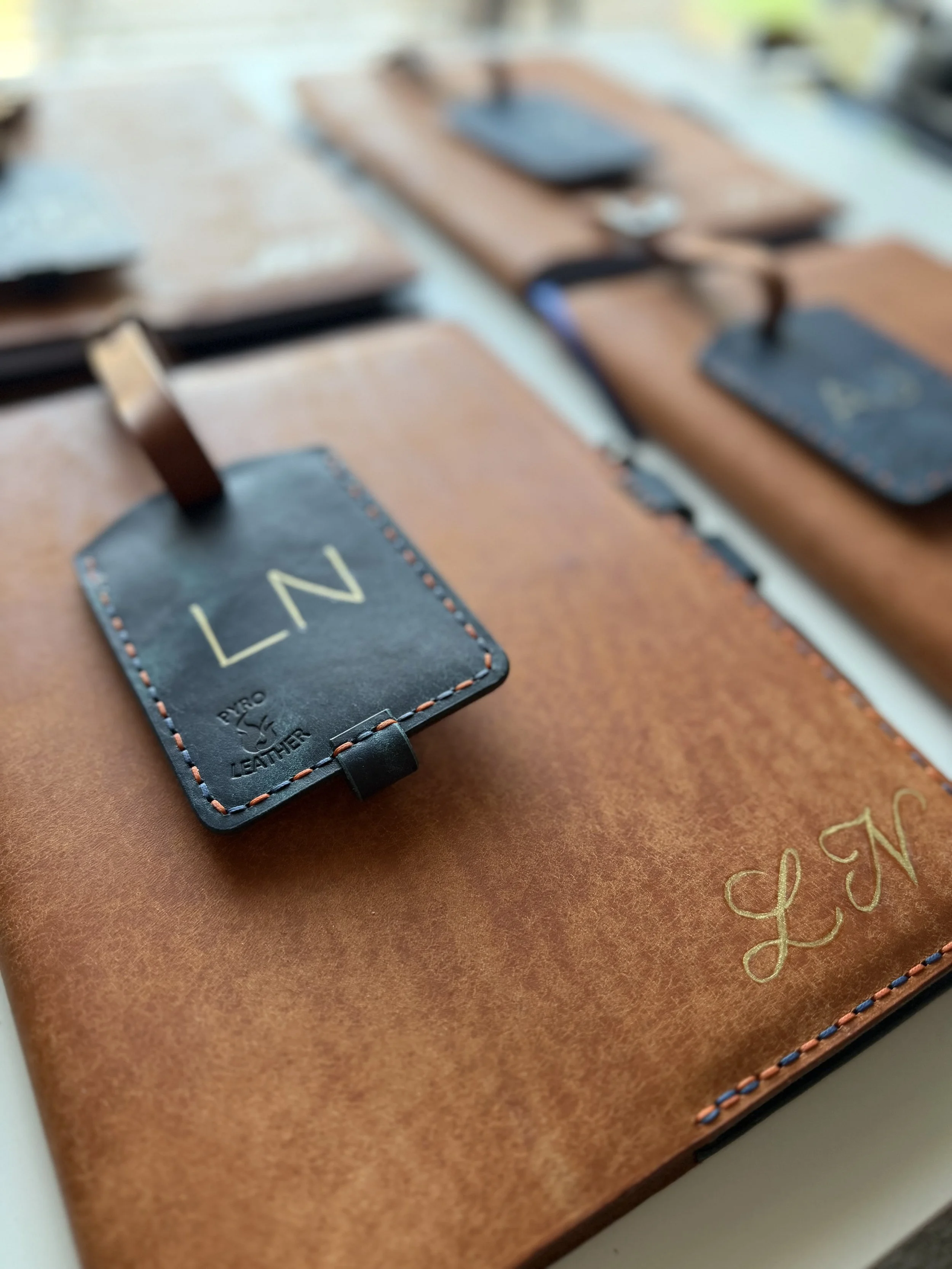 Conference Gifts: Painted Monogram on Leather Notebook Cover and Tag