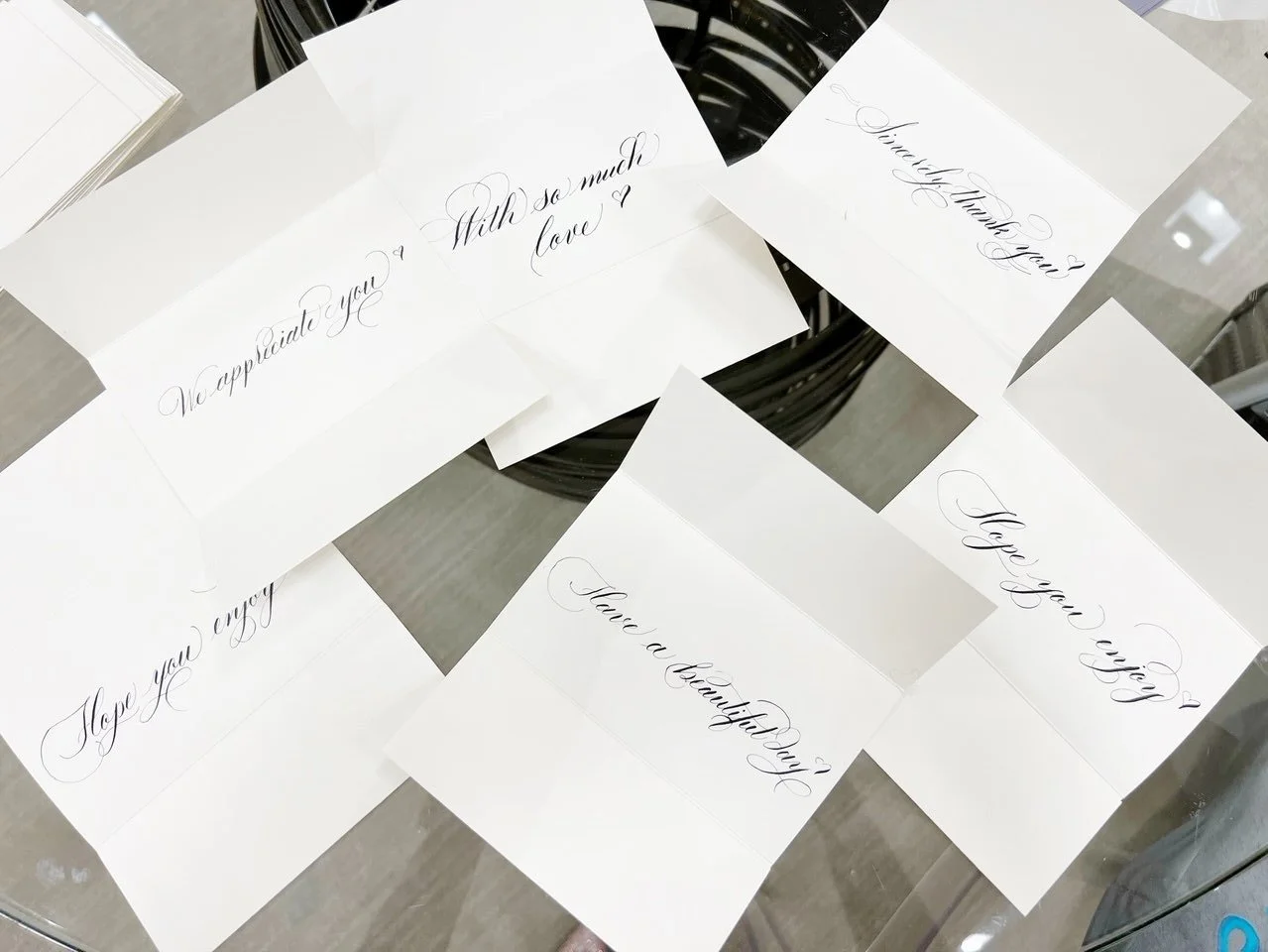 Luxury brand stationery calligraphy on folded note cards 