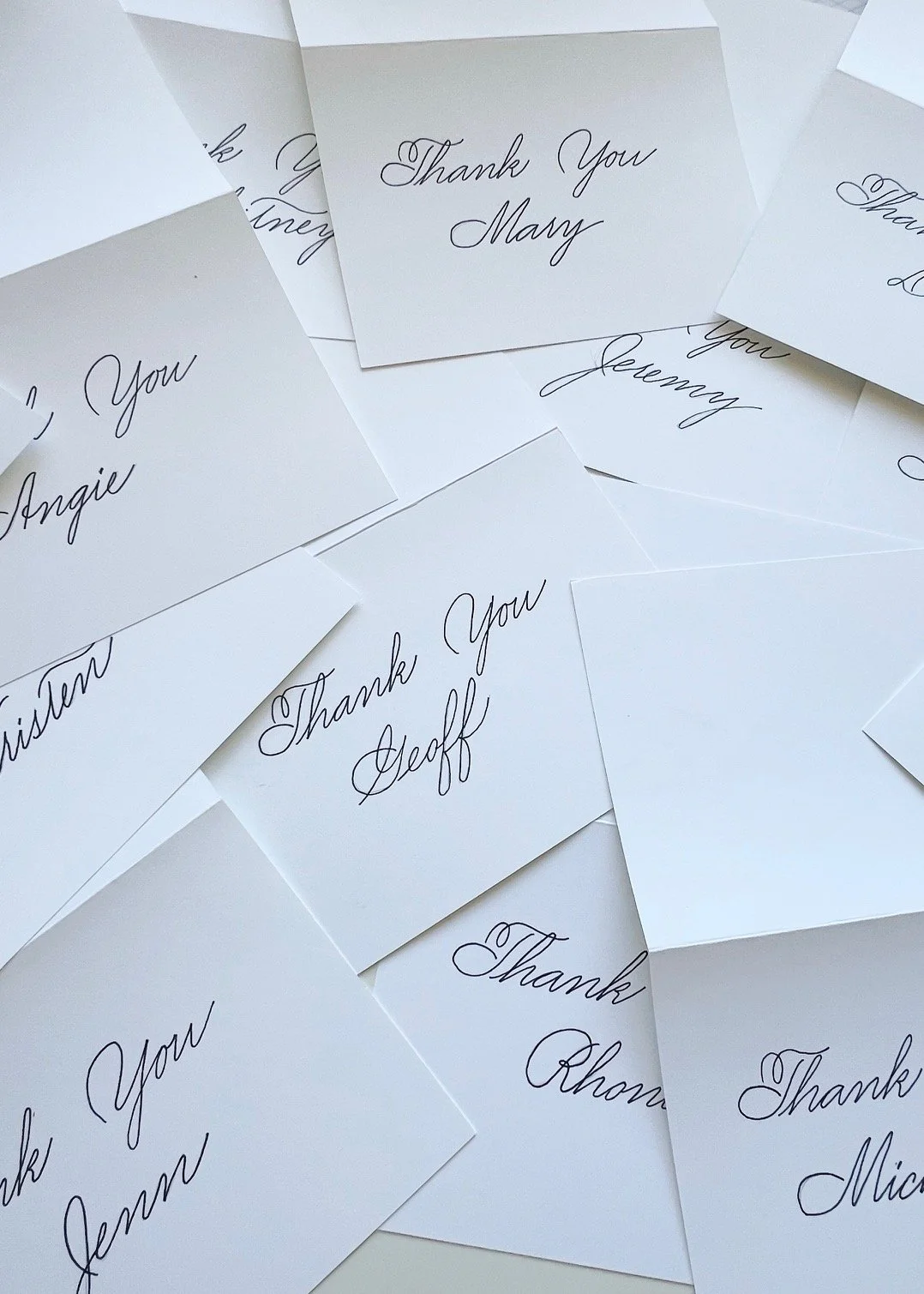 Personalized folded thank you cards in calligraphy with recipients' names