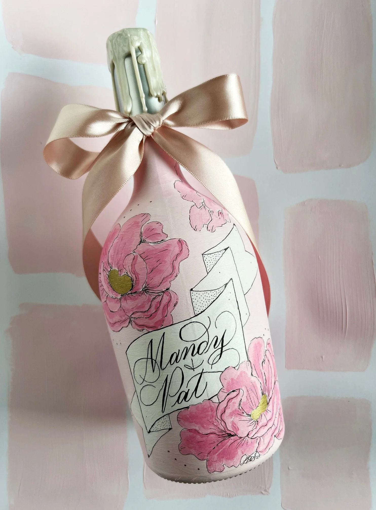 Rose bottle hand painted with pale pink background, pink florals and calligraphy names banner