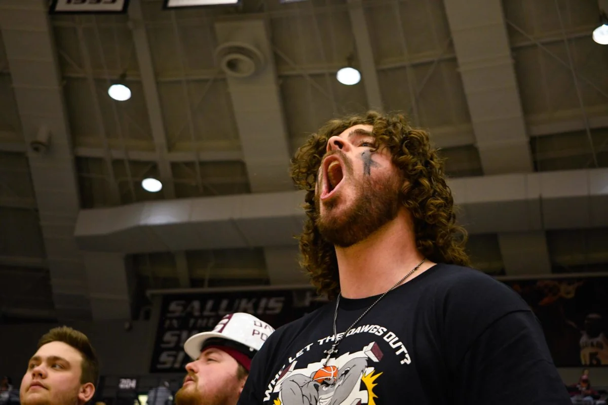 Dawg Pound Executive Vice President Chris Catron cheers as SIU Men’s Basketball closes in on wrapping up a game Feb. 22, 2025 at Banterra Center in Carbondale, Illinois.