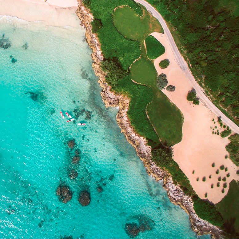 Aerial view of golf course meeting Bahamian coast