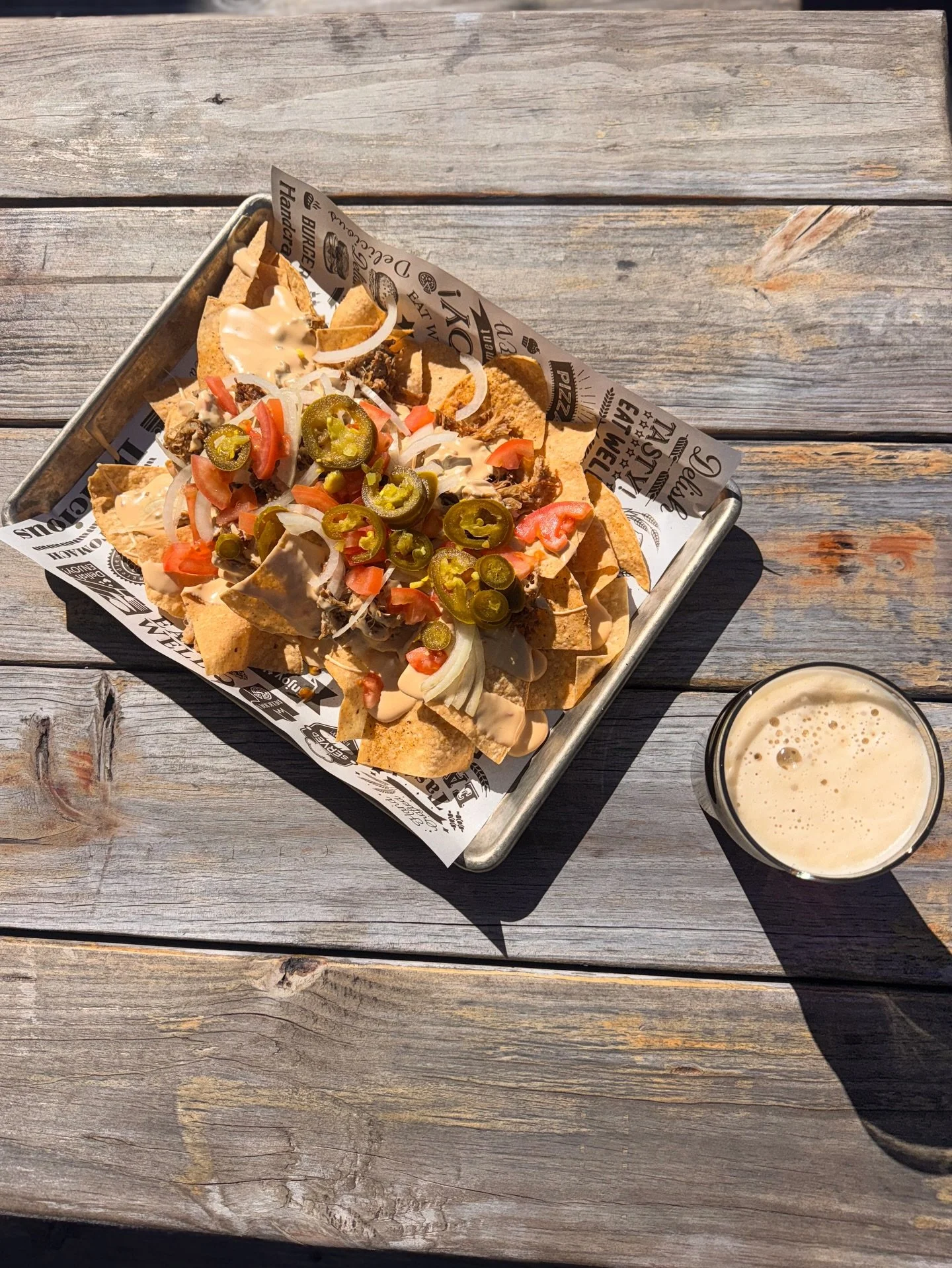 Peep one of our new menu items 👀

Come try our classic nachos today! Piled high with mojo pork, jalape&ntilde;os, onions, tomatoes, and queso blanco! Pair them with a Rambler Amber Ale and they&rsquo;ll be sure to hit the spot 🍻