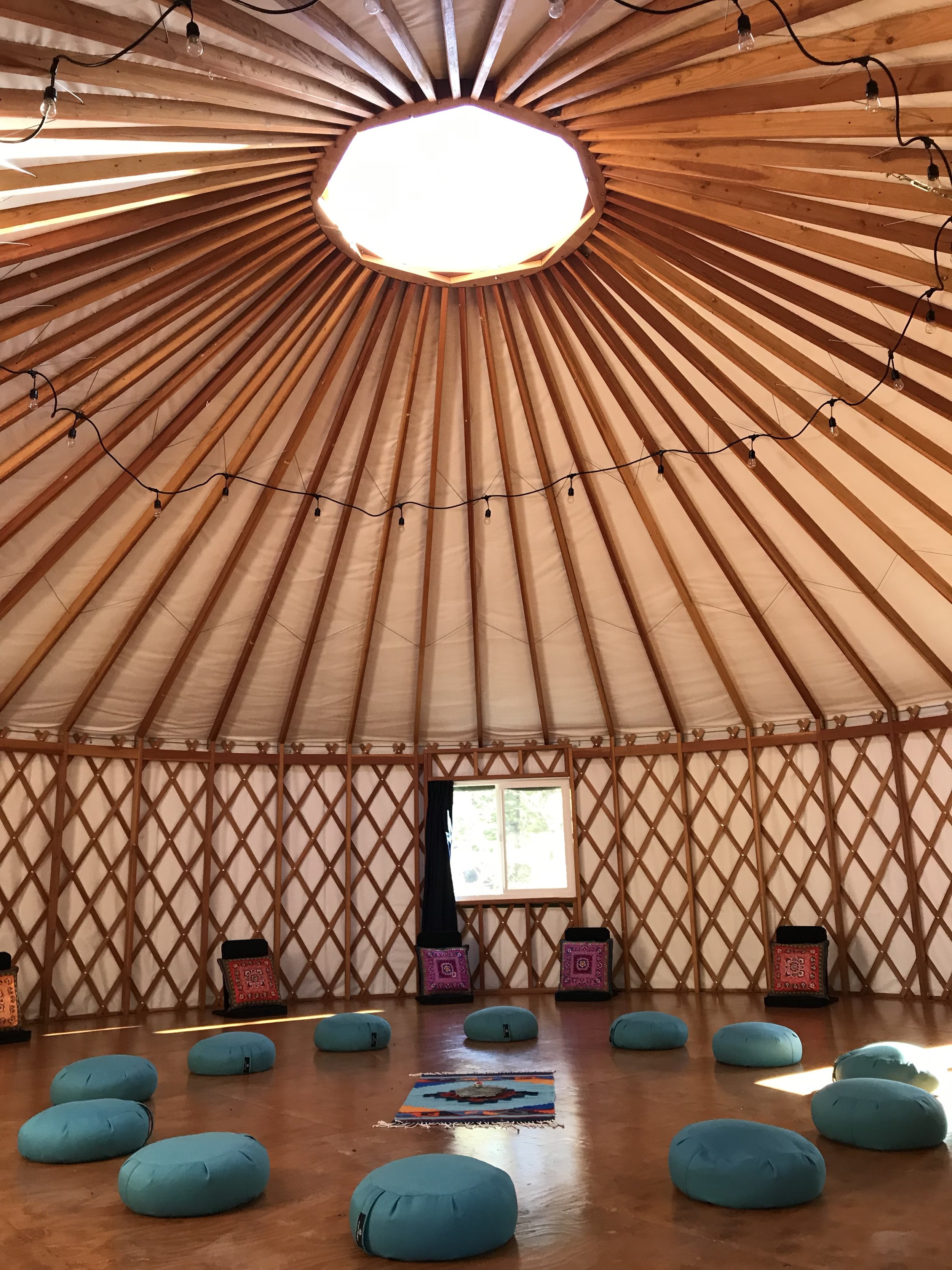 Inside Yurt with Pillows.jpeg