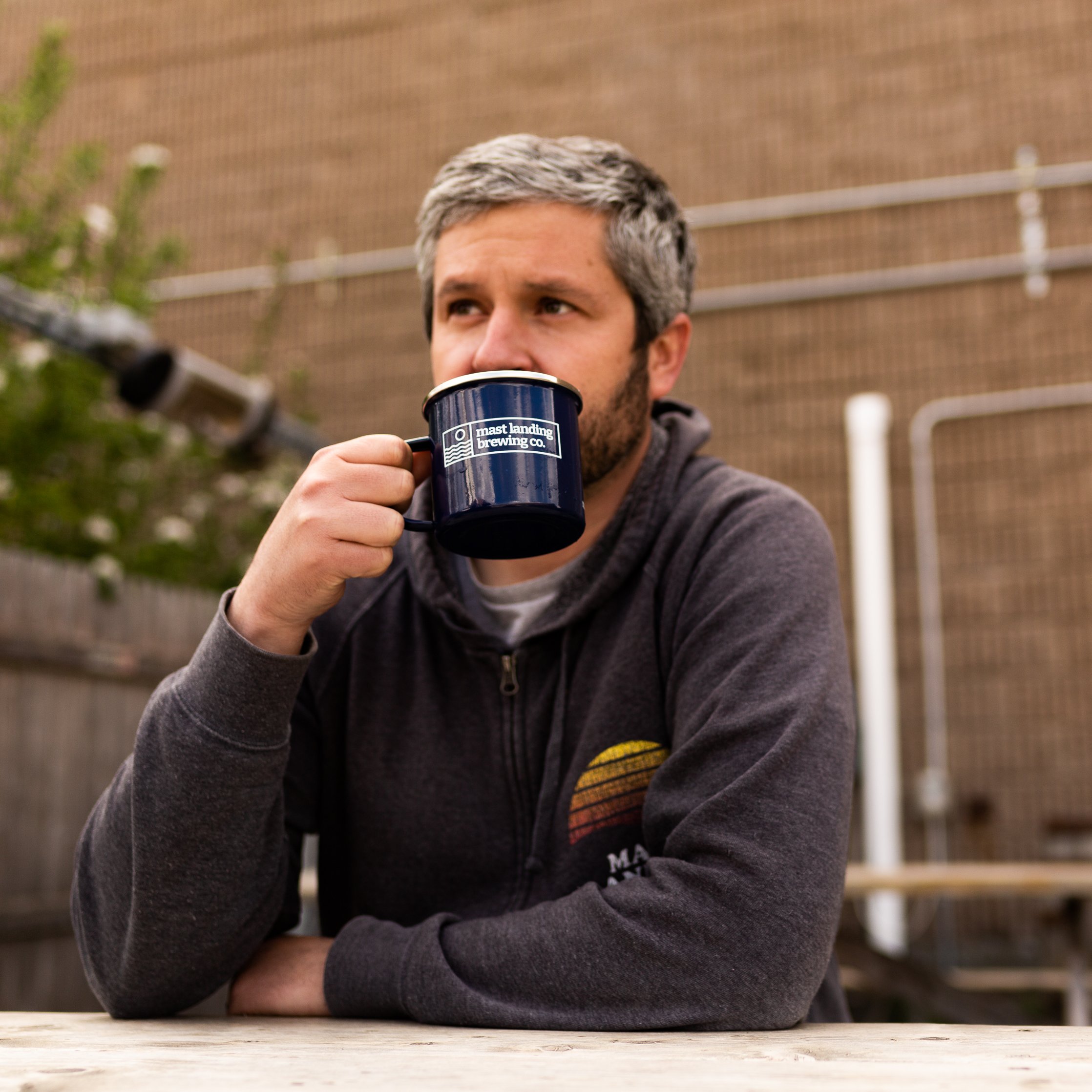  man sipping a cup of coffee 