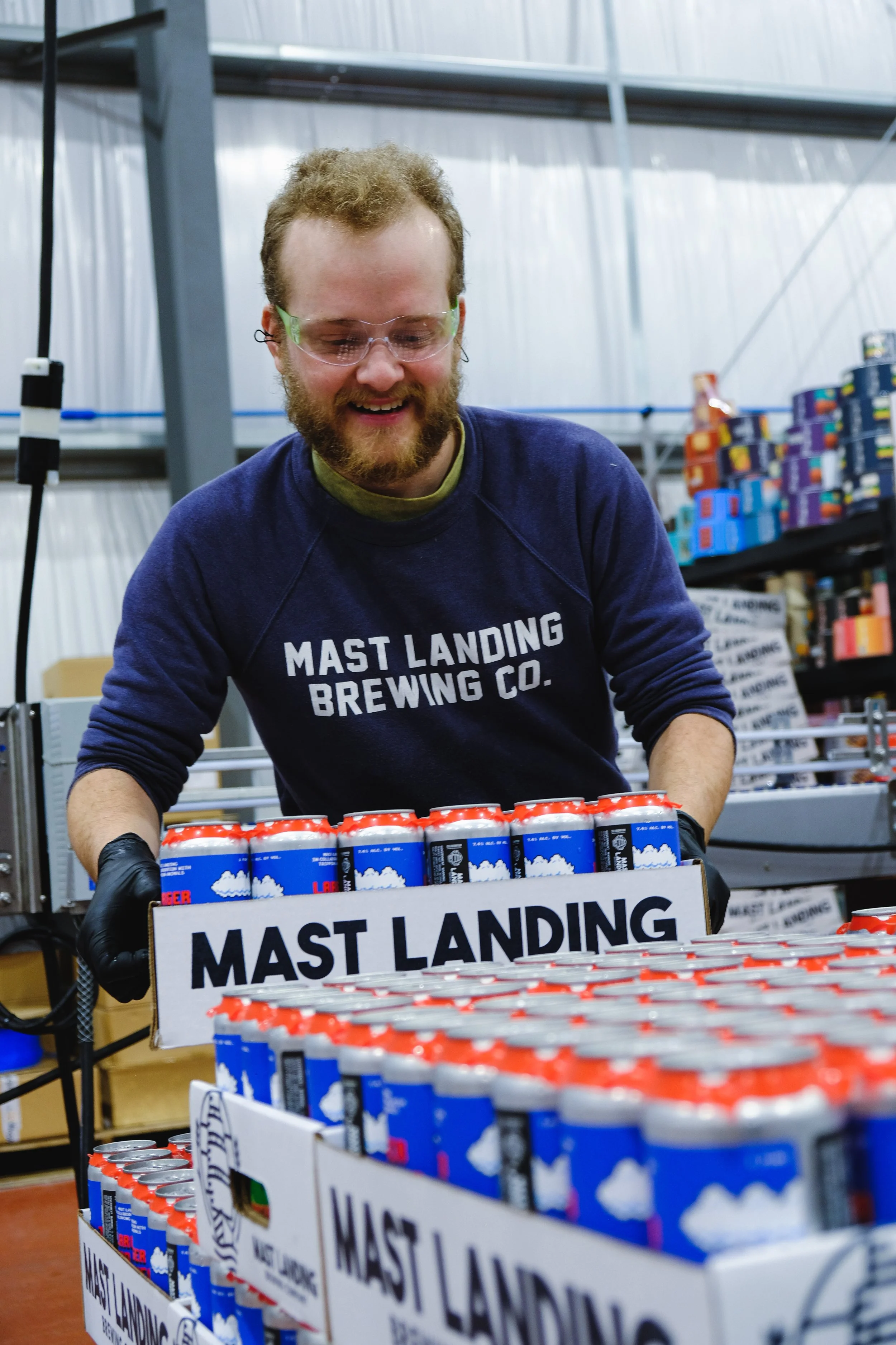 mast landing employee lifts beer