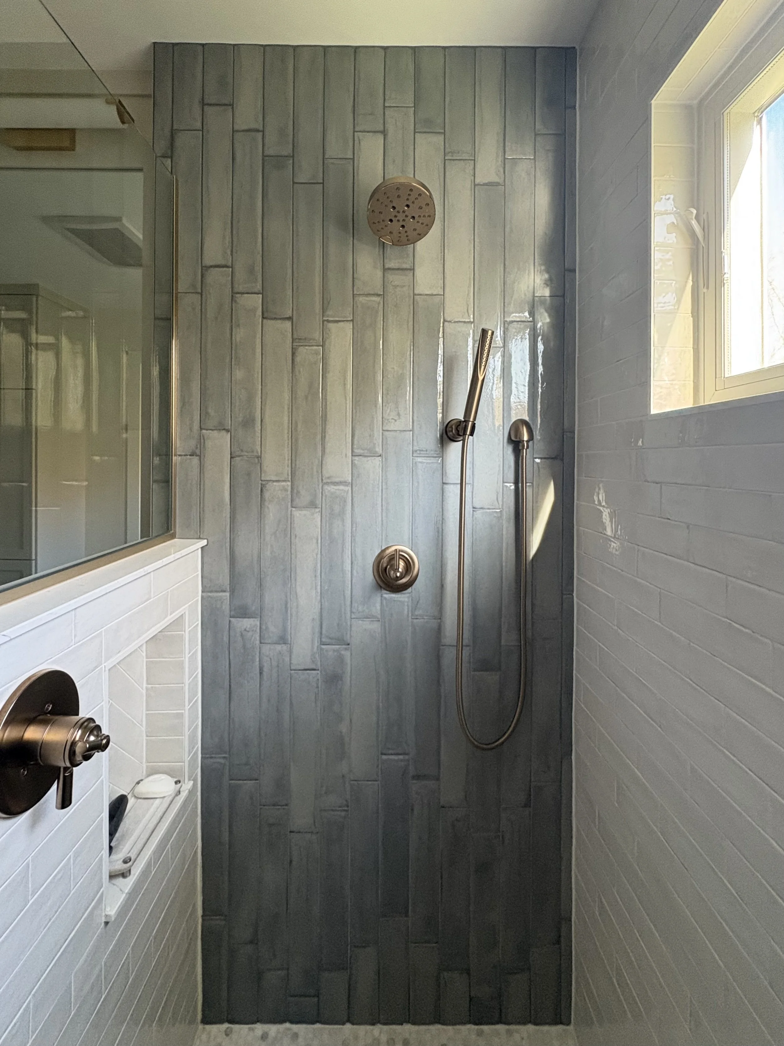 Primary Bath Shower tile and gold fixtures.jpg