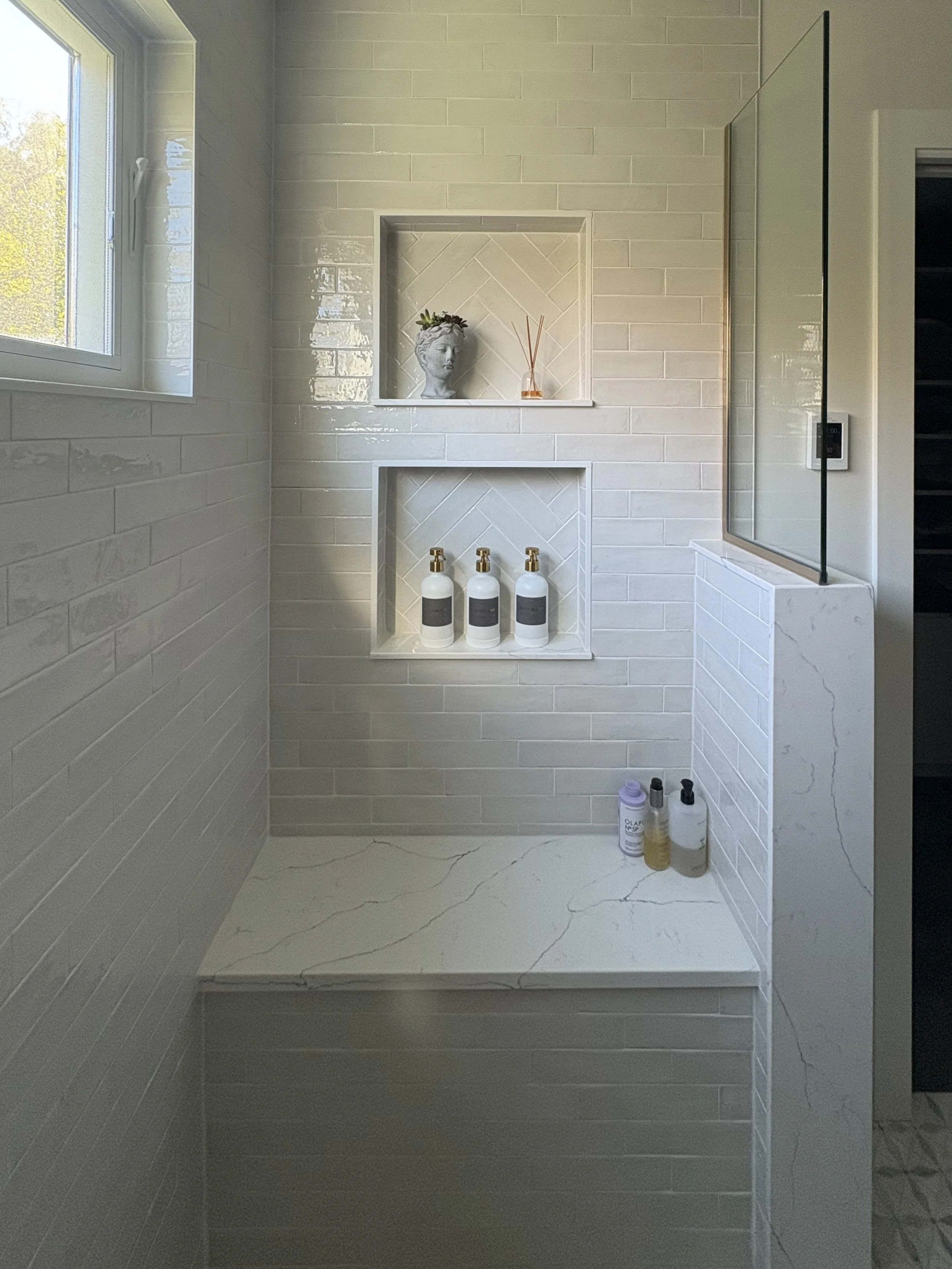 Shower bench and niche with subway tile.jpg