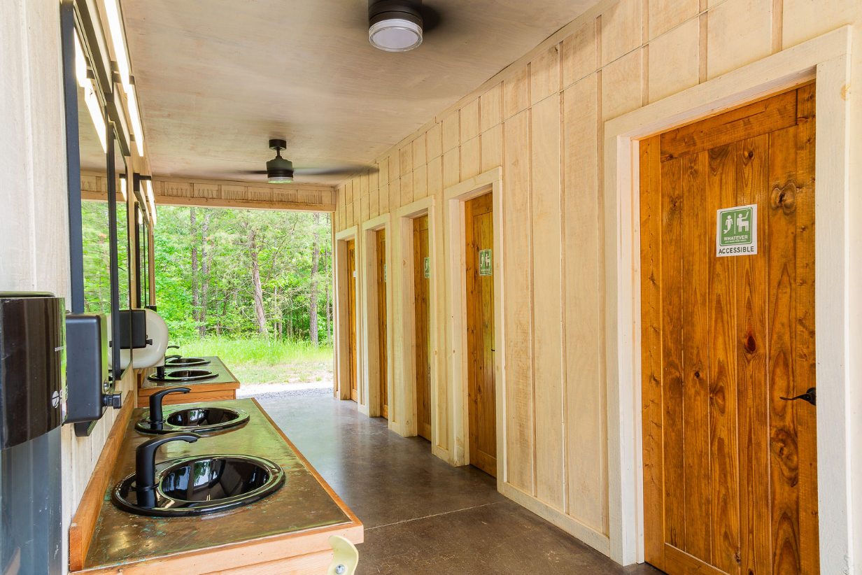 Sink stations and private restrooms at Bohamia bath house in Alabama