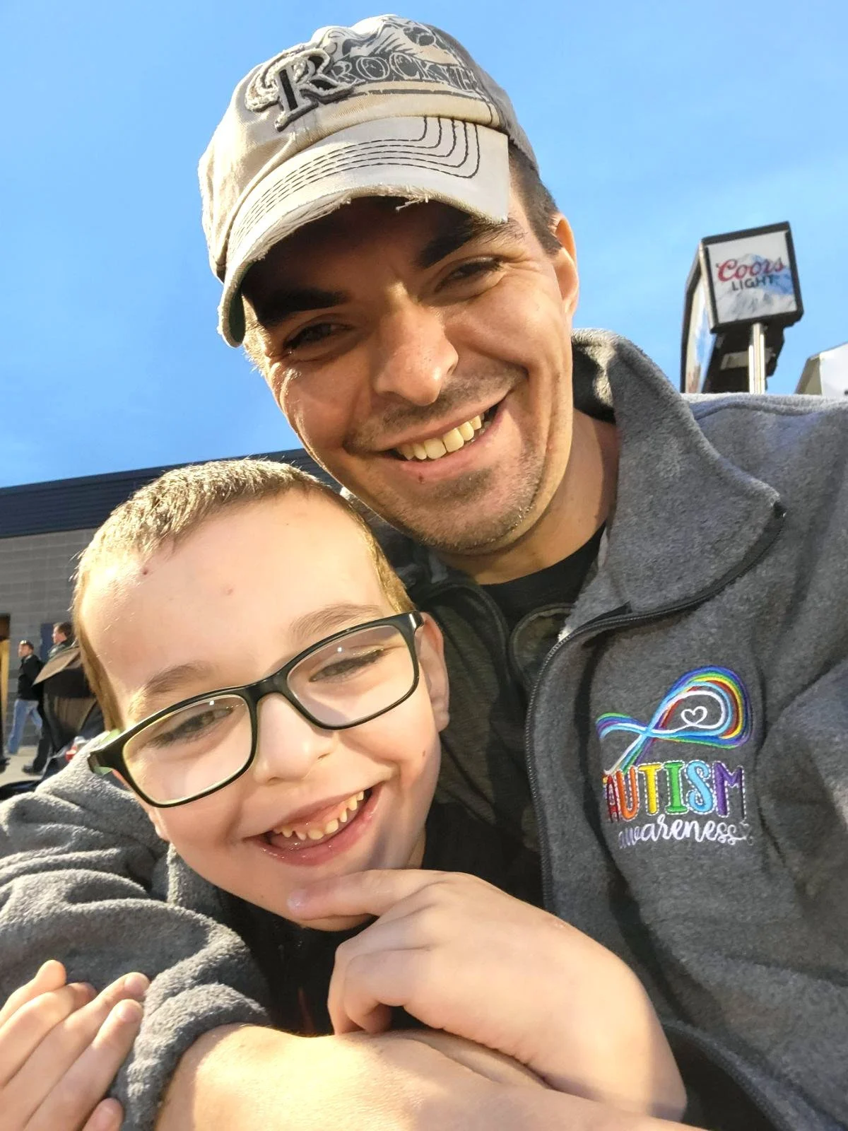 A father and son at a Colorado Rockies game
