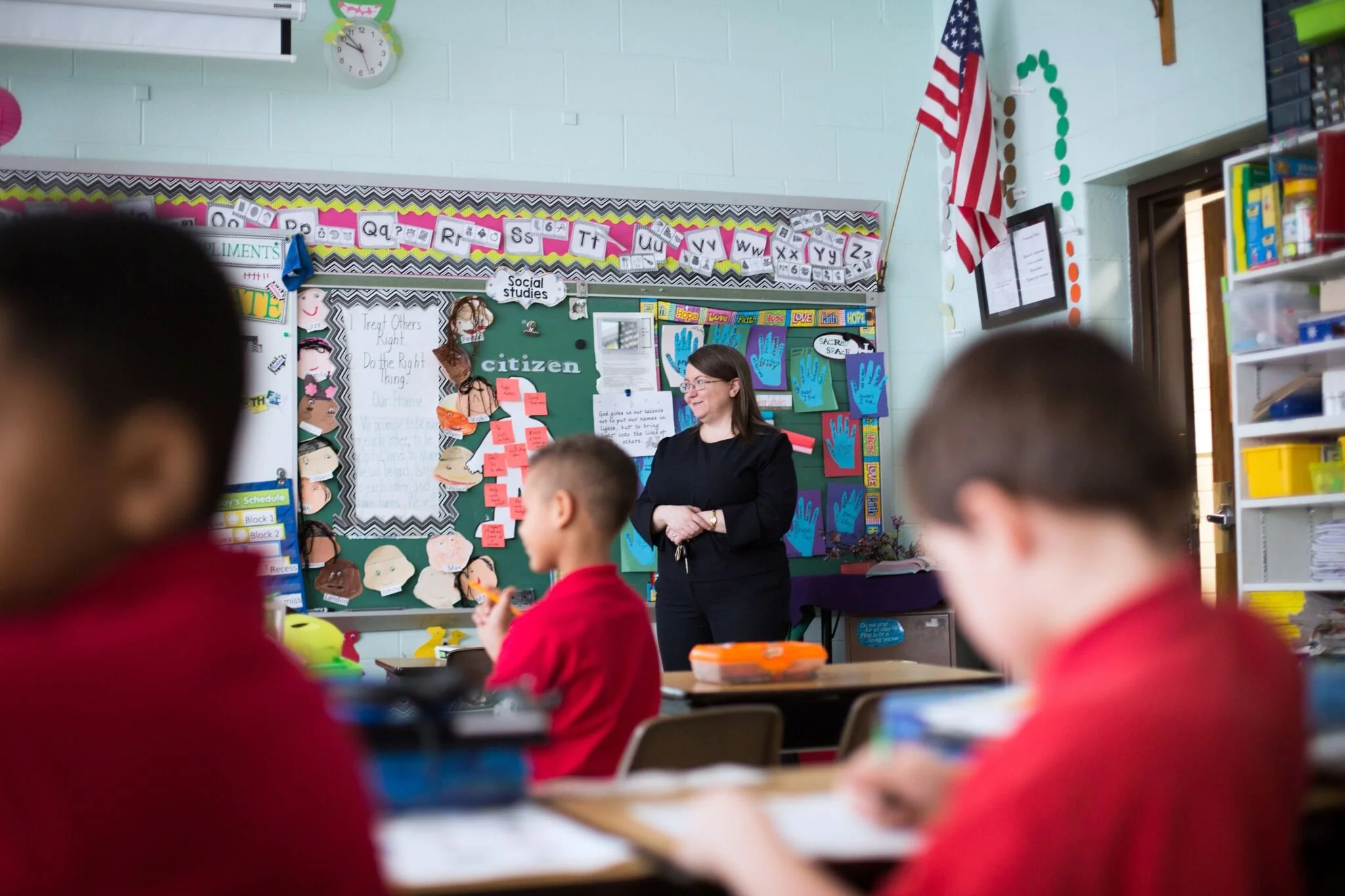 a proud teacher in her classroom