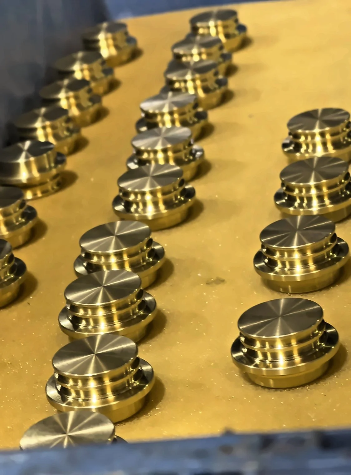 Brass parts in an inspection tray