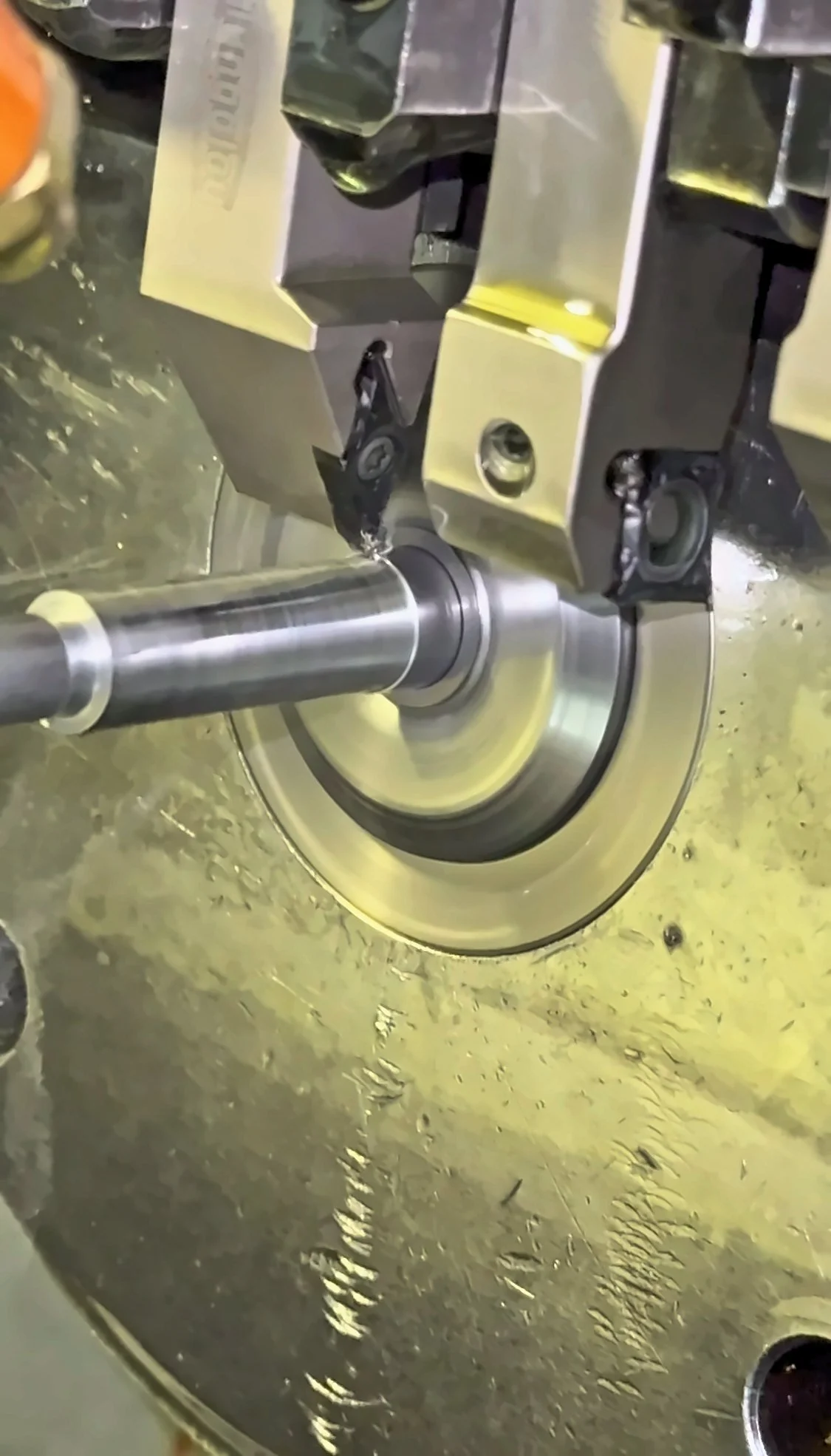 CNC lathe turning a part at PBI.