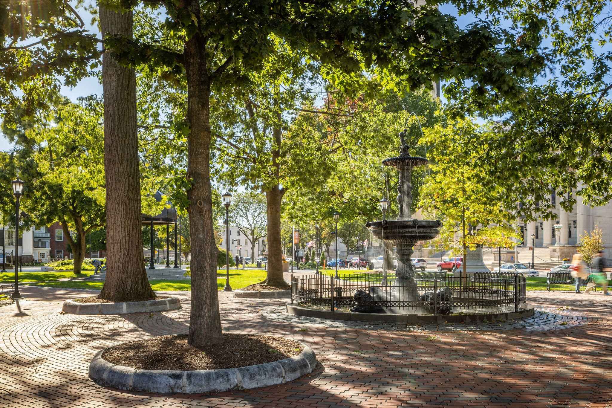 Court square with historic fountains, monuments and shade canopy