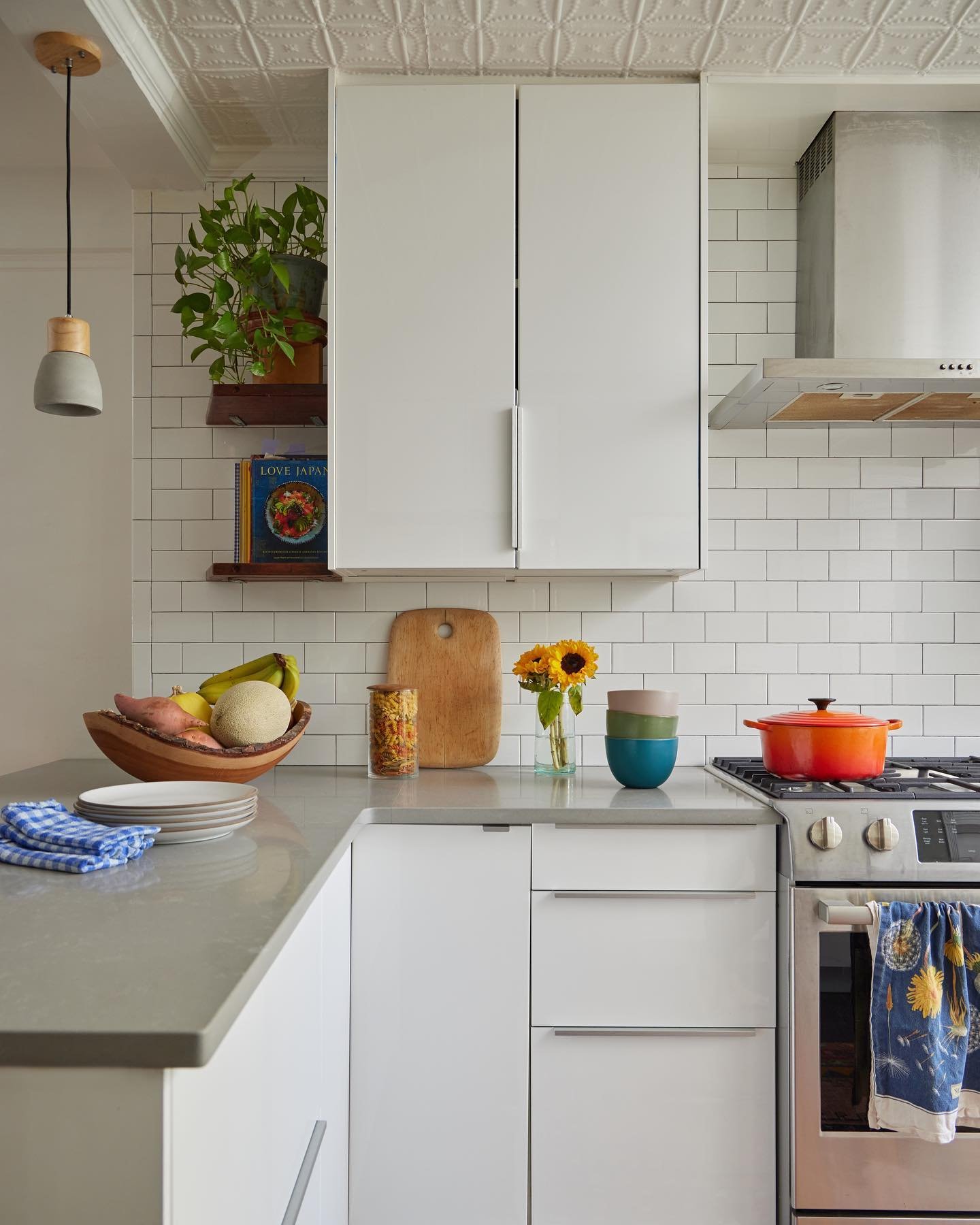 Where we spend all our time - the kitchen. At first I was turned off by the Ikea kitchen renovation the previous owners did, but then quickly saw how functional and blank slate it was. A few personal touches, color of course, and it became our own. I