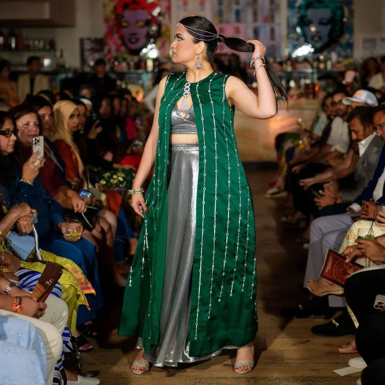A vision in emerald and silver — Panna Noor embodies the dialogue between heritage and modernity.
The fluid silver silhouette layered with a hand-embroidered emerald kaftan glimmers with celestial mirror work, capturing the grace of tradition a