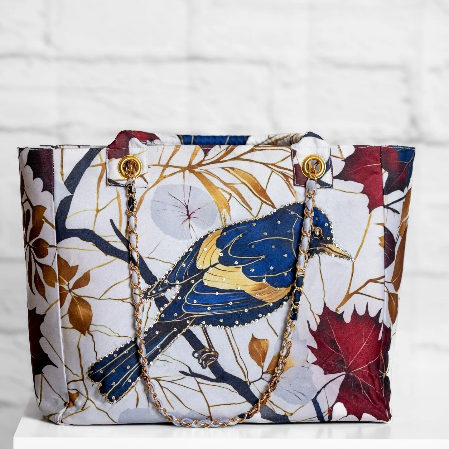 ✨ From the Aangan Collection, the Meher Bag bursts with color and charm! Featuring a vibrant multicolor bird-and-floral print and delicate hand-done sequin embellishments, it perfectly blends playfulness with elegance. 💐💫 A standout piece that adds