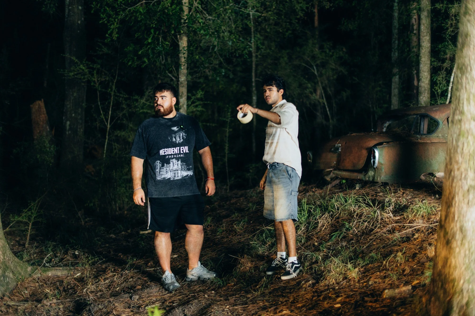 Matt Salcedo and the assistant director planning a scene in the woods.