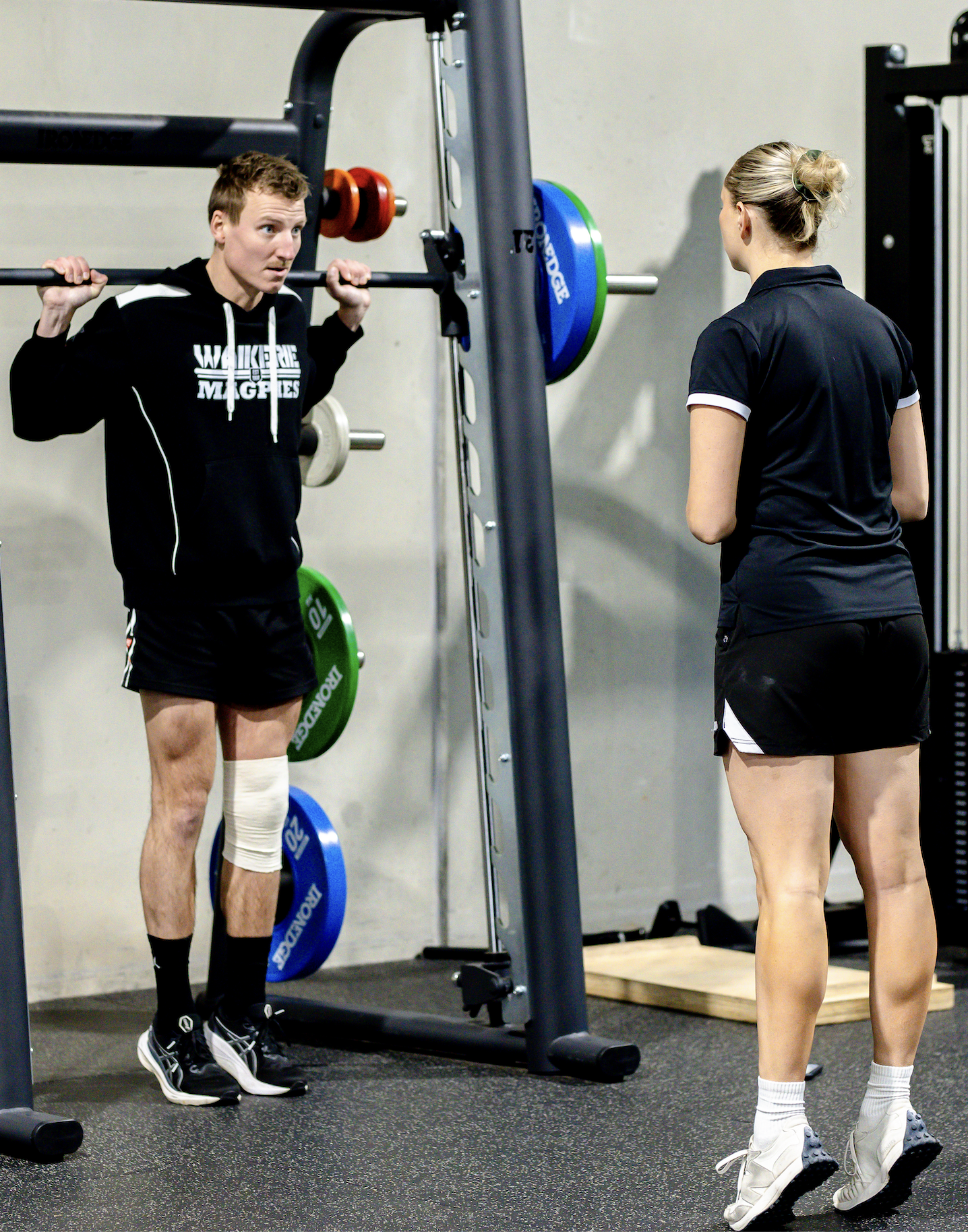 Calf raise physio demonstrating exercise
