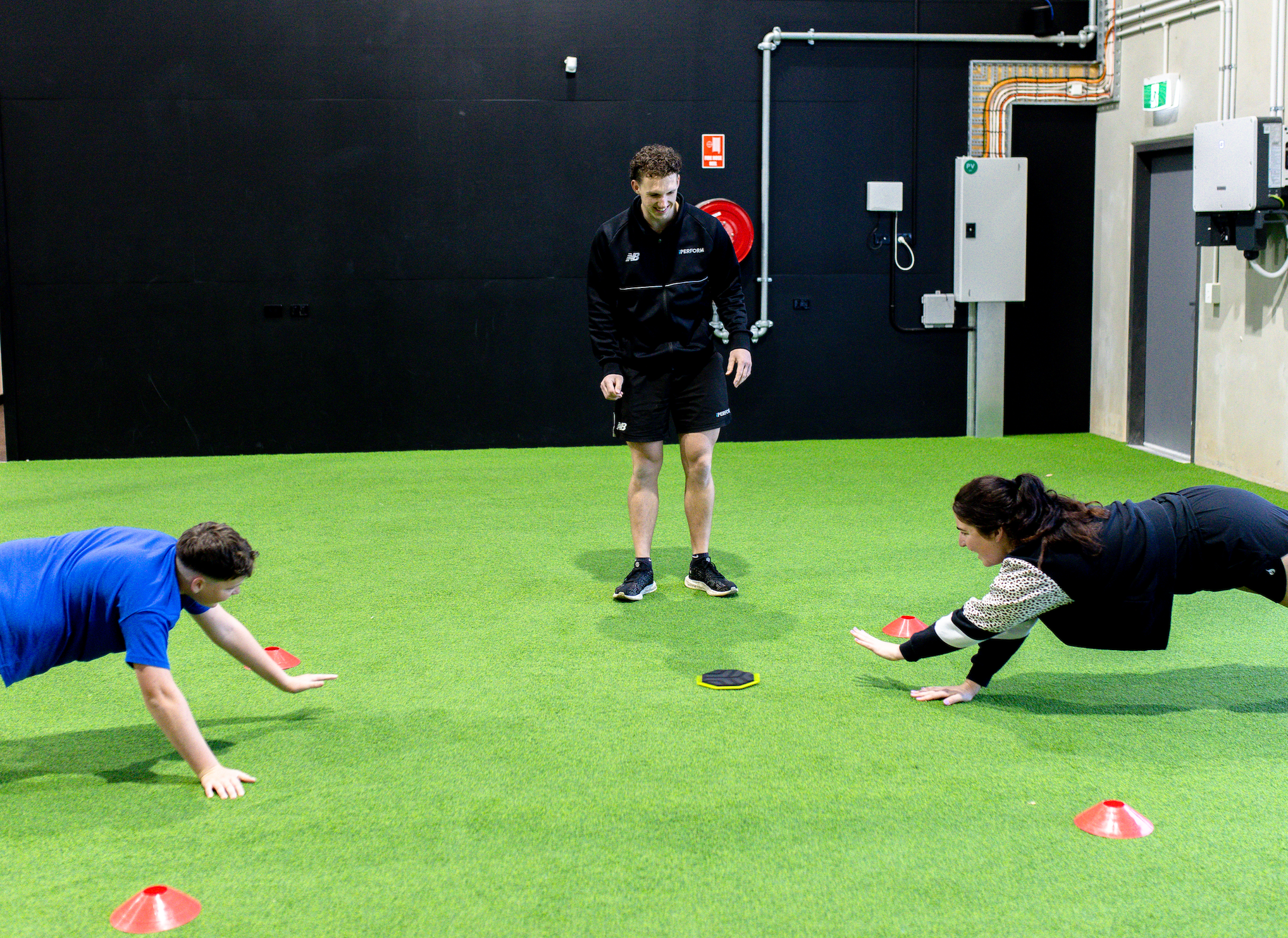 youth athlete with S&C coach warm up games