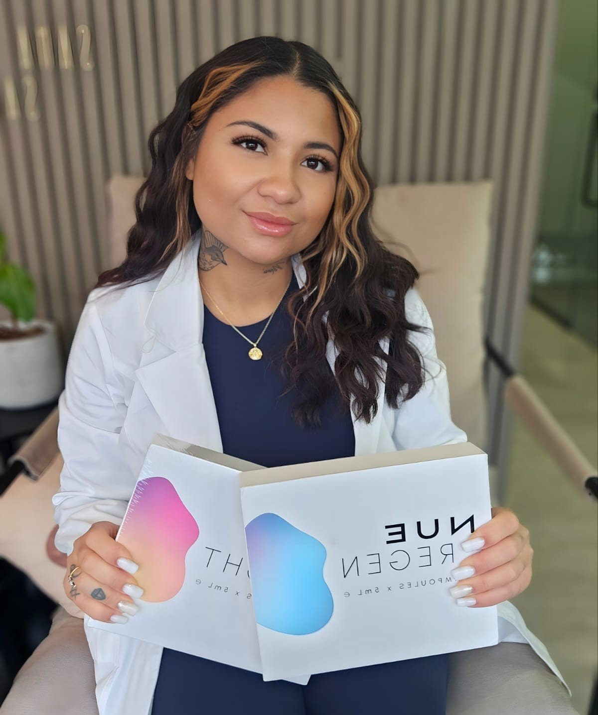 Jaylene pictured holding a training booklet at Wholesome Empire