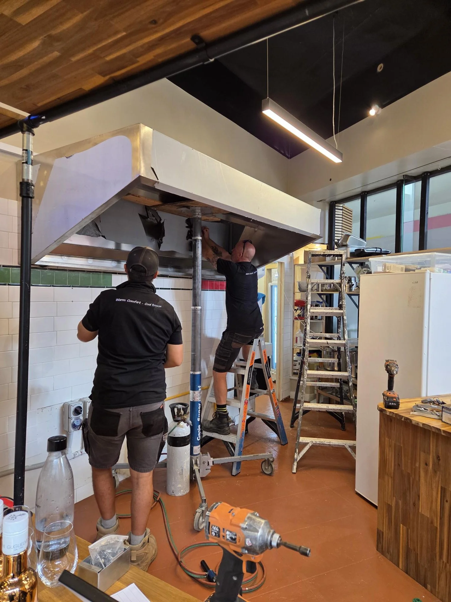 Breeze Northland technicians installing a commercial kitchen extraction system