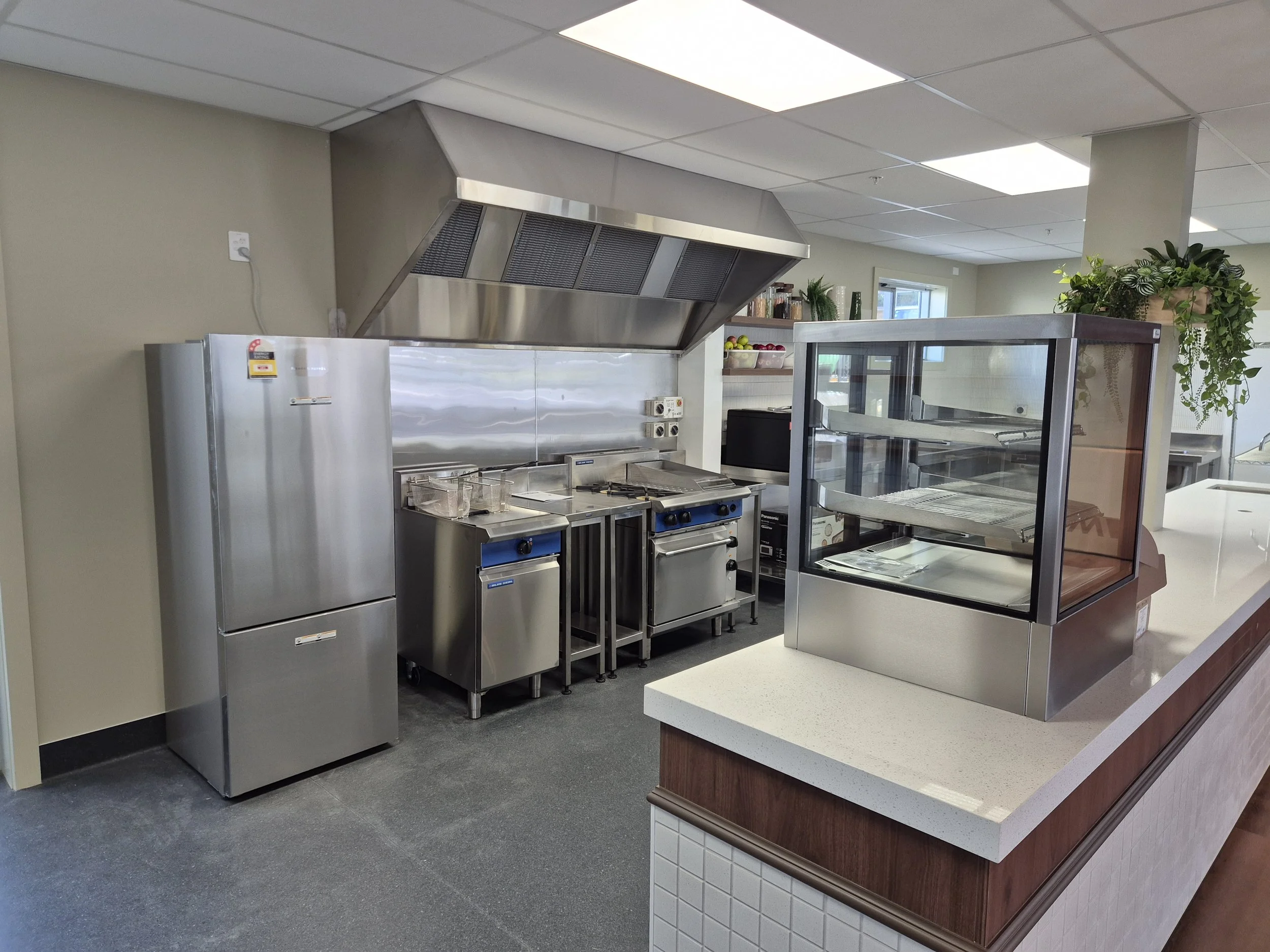 Commercial kitchen extraction hood and ventilation system installed by Breeze Northland