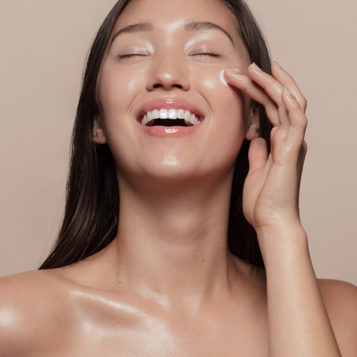 Woman smiling with glowing skin