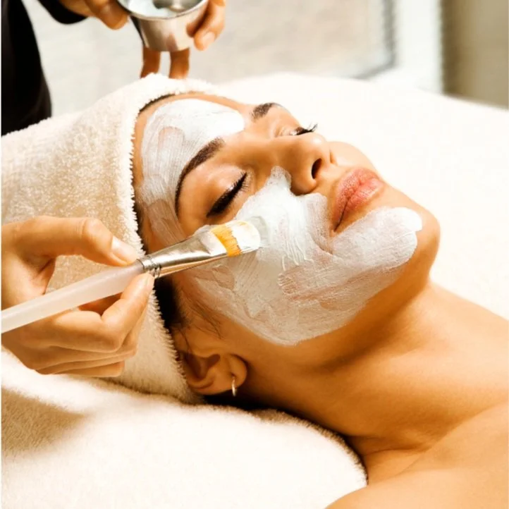 Woman laying down receiving facial