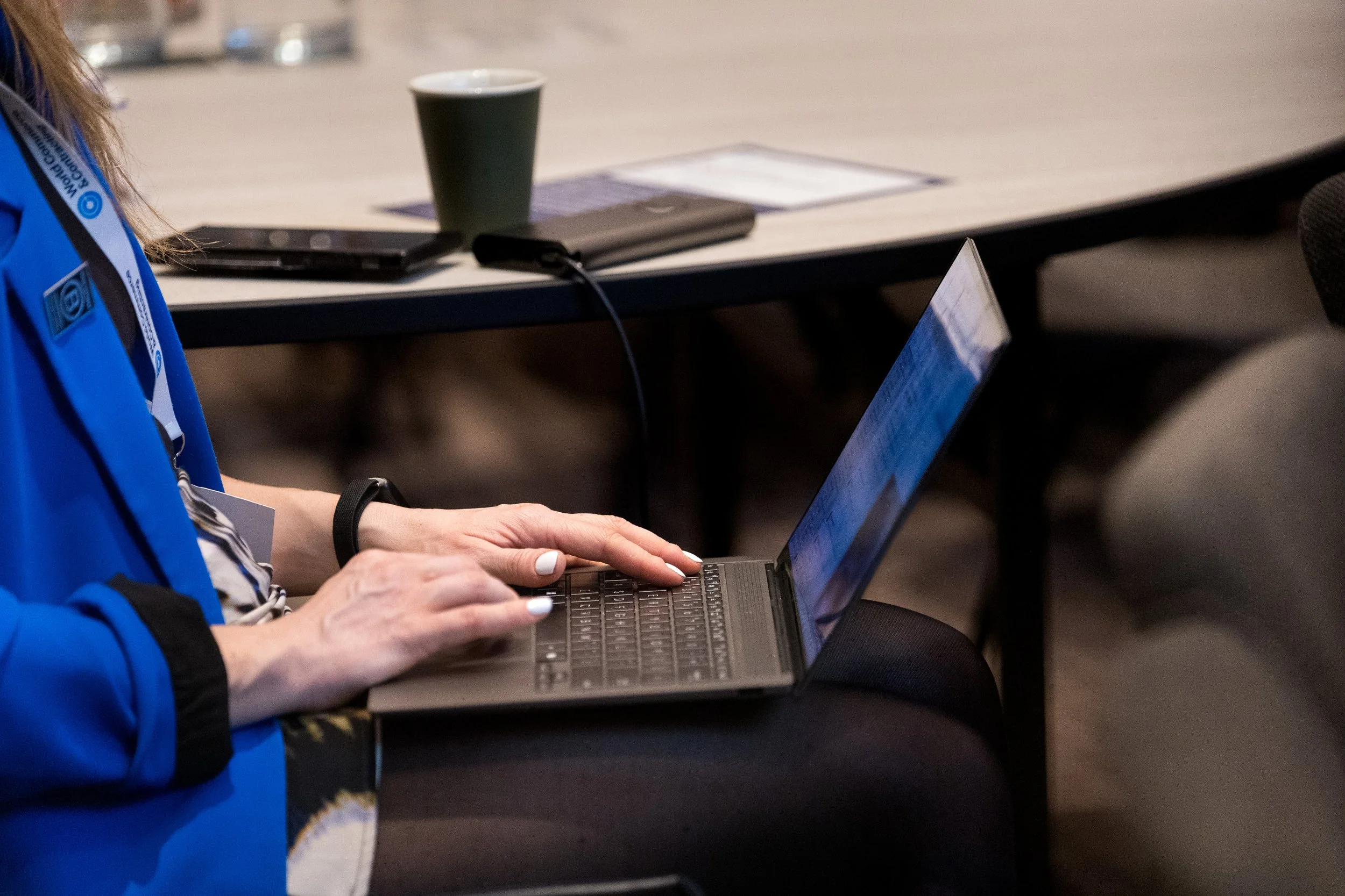 Verity writing on sticky notes on wall