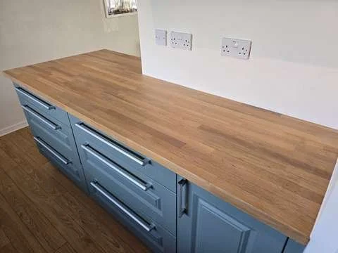 A freshly restored, smooth oak wood worktop treated with a matte trade-grade hardwax oil finish.