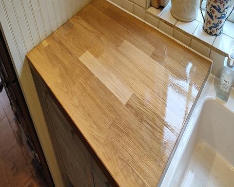 Sanded and freshly oiled solid oak kitchen worktop with all water stains completely removed.