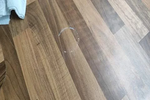 A chemical stained wood effect laminate worktop repair