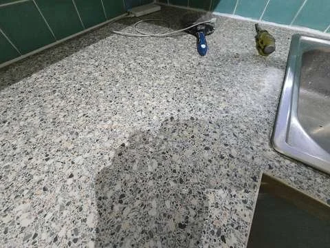 This laminate granite worktop effect is now completely restored removing all traces of the swollen and open join.